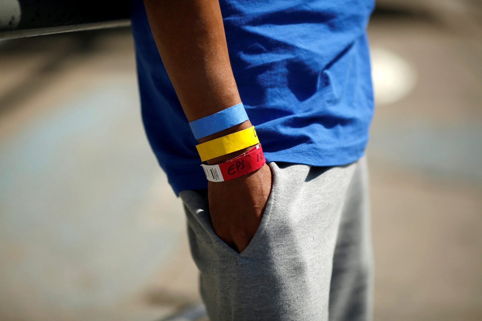 Bracelets used by the U.S. Border Patrol are seen on the arm of a Central American migrant near the Paso del Norte international border bridge in Ciudad Juarez, Mexico, Oct. 1, 2021. The migrant was expelled from the U.S. and sent back to Mexico under Title 42. (CNS photo/Jose Luis Gonzalez, Reuters)