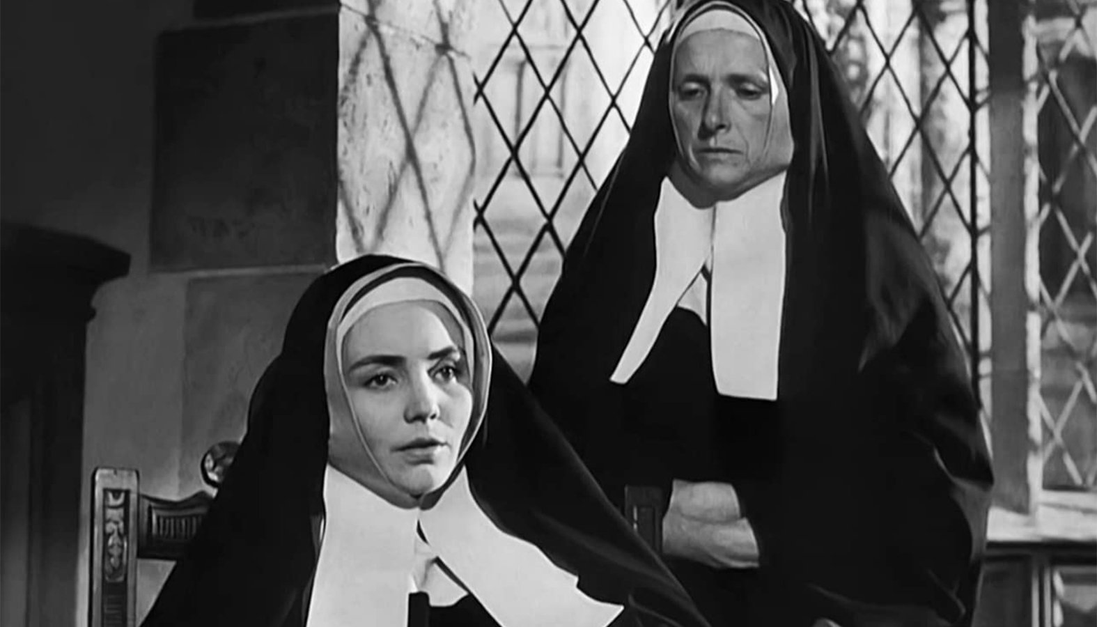 Jennifer Jones (left), as Bernadette Soubirous, and Gladys Cooper, as Sister Marie-Thérèse Vauzou, in "The Song of Bernadette." (IMDB)
