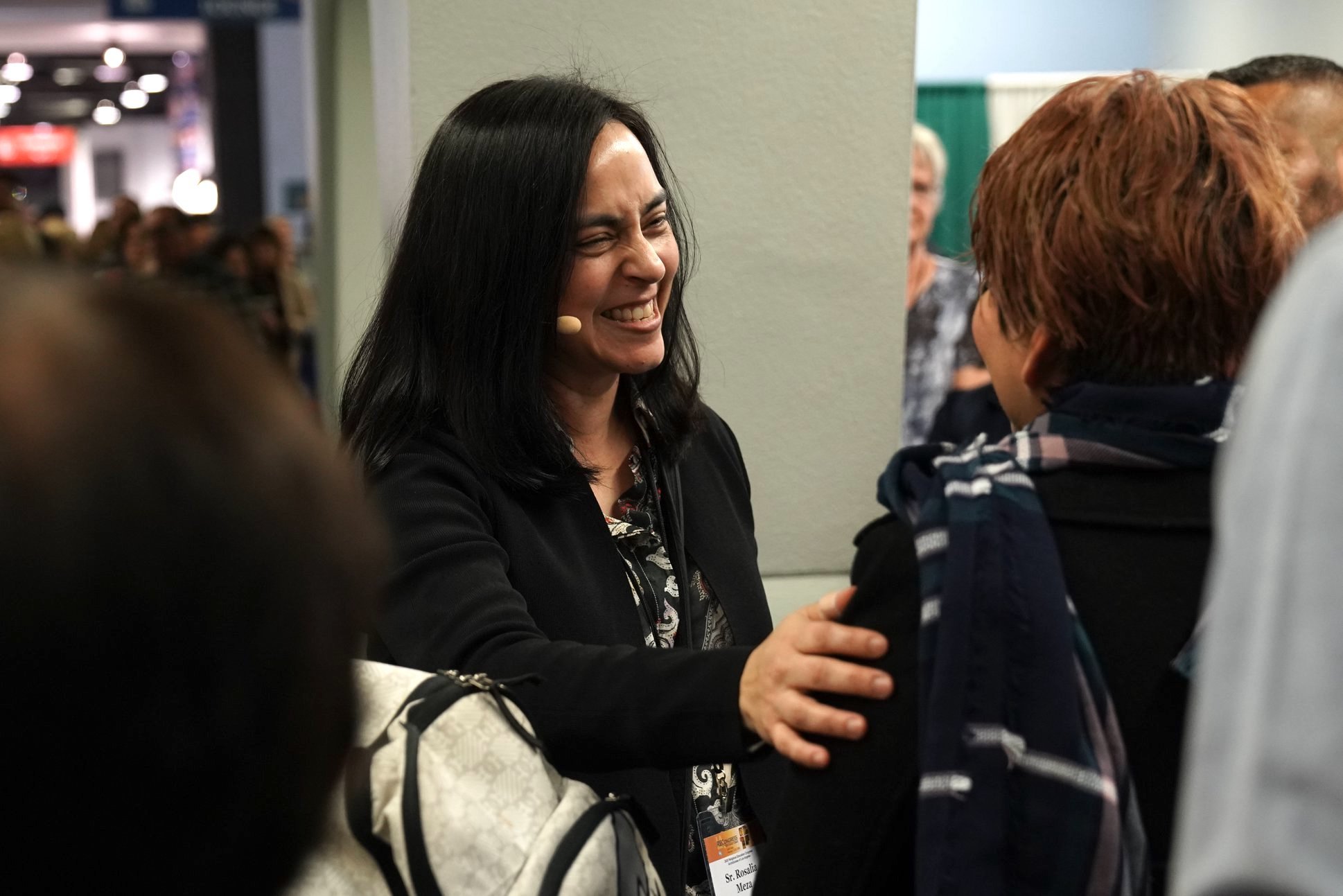 Sister Rosalia Meza, director of the Office of Religious Education, greets an attendee after the Opening Ceremony and Welcome at the Anaheim Convention Center for RECongress 2020. (ADLA)