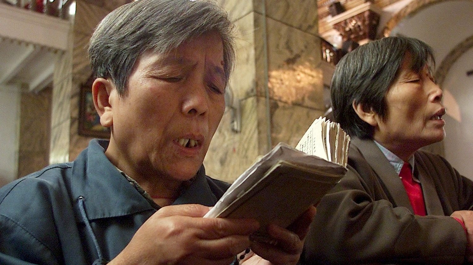 Elderly Chinese women are pictured praying at a Catholic church in Beijing in a file photo. (CNS photo/Reuters)