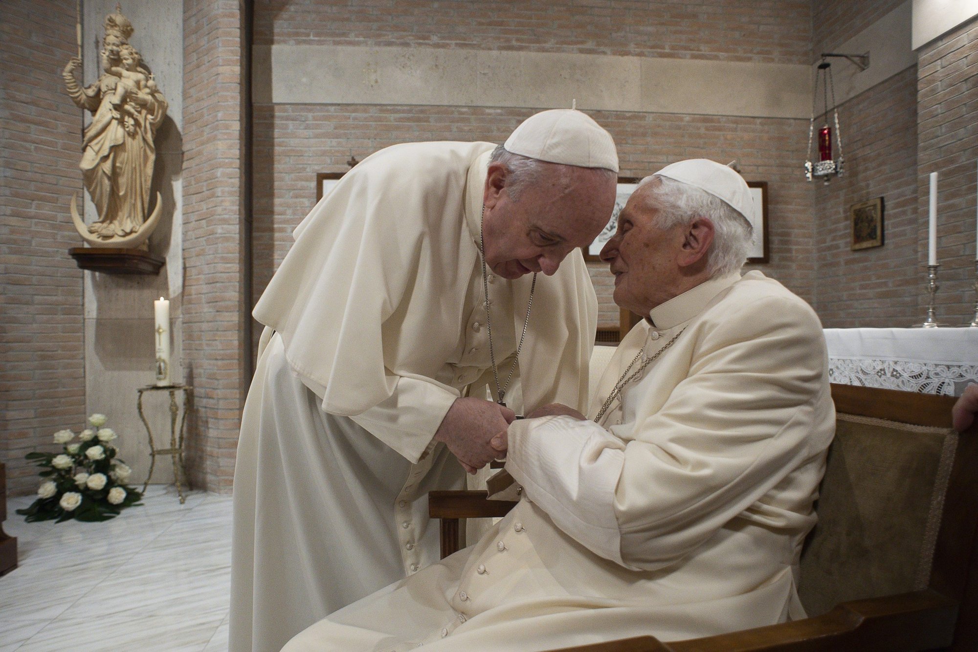 Pope Francis visits with Pope Benedict XVI at the retired pope's residence after a consistory at the Vatican in this Nov. 28, 2020, file photo. This photo was released by the Vatican Feb. 9 after Pope Francis, at his general audience, praised Pope Benedict's comment in a statement the previous day recognizing his own presence before "the dark door of death." (CNS photo/Vatican Media)