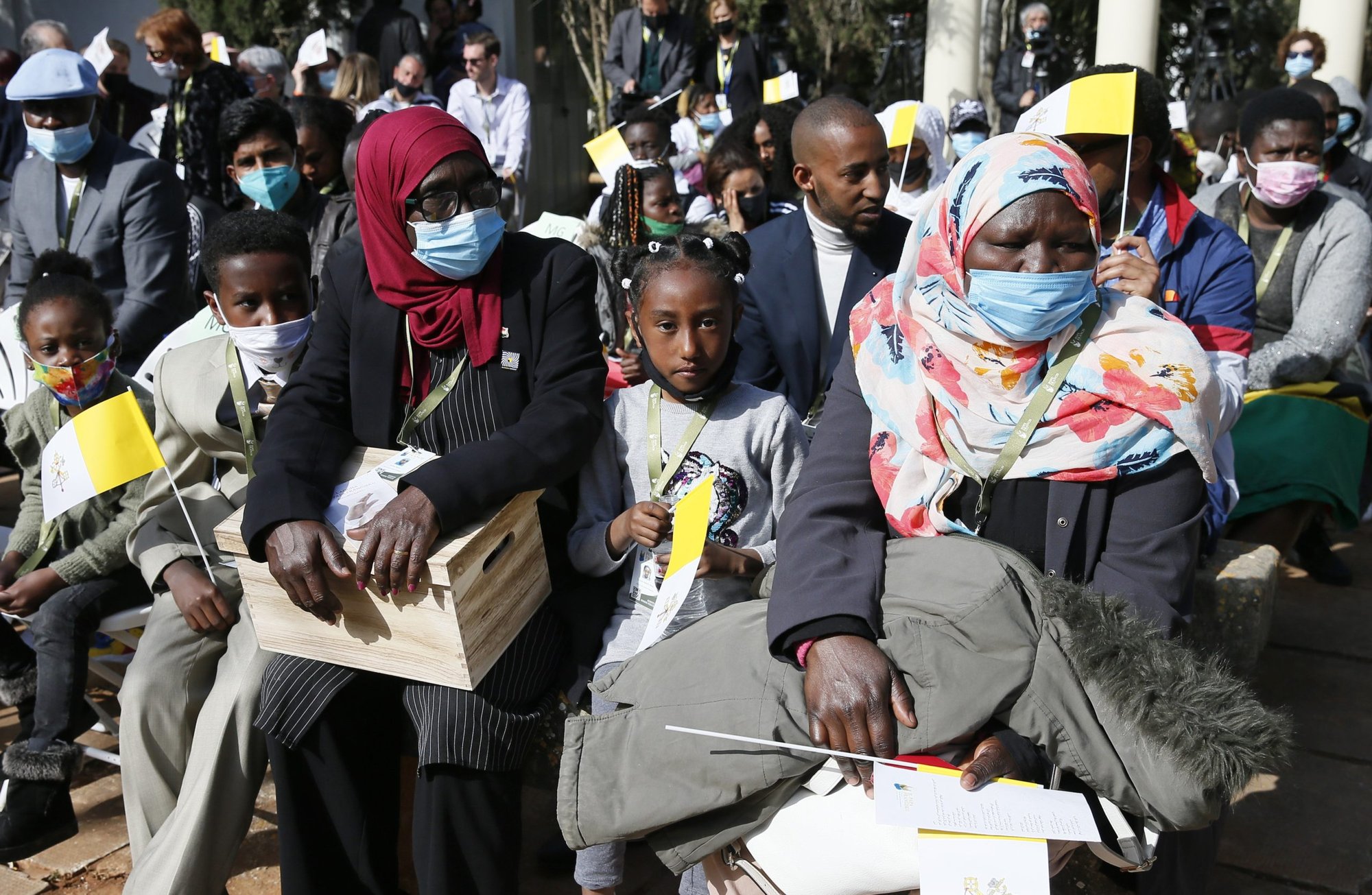 People wait for the start of Pope Francis' meeting with migrants at the John XXIII Peace Lab's Center for Migrants in Hal Far, Malta, April 3, 2022. (CNS photo/Paul Haring)