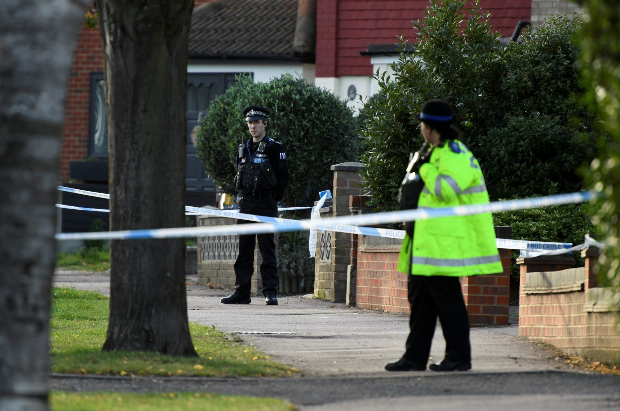 Police officers guard the site where Sir David Amess, a member of the governing Conservative Party, was stabbed while meeting constituents in Leigh-on-Sea, England, Oct. 15, 2021. Following the outcry over the murder, police in England have changed guidance to allow priests to access crime scenes to give last rites to dying Catholics. (CNS photo/Tony O'Brien, Reuters)