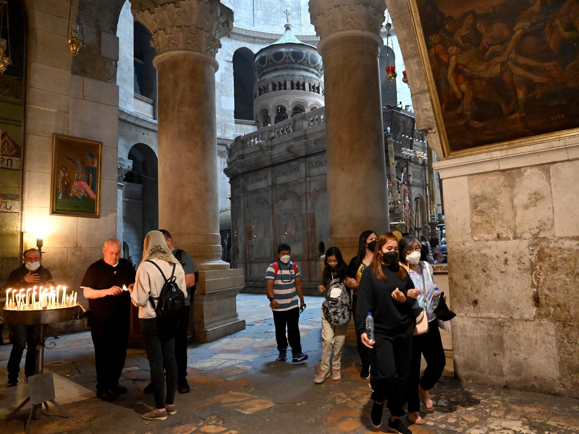 Tourists visit the Church of the Holy Sepulcher in Jerusalem's Old City April 3, 2022. With Palestinian-Israeli tensions rising, three religions prepare to celebrate holidays of Easter, Ramadan and Passover after two years of pandemic restrictions. (CNS photo/Debbie Hill)