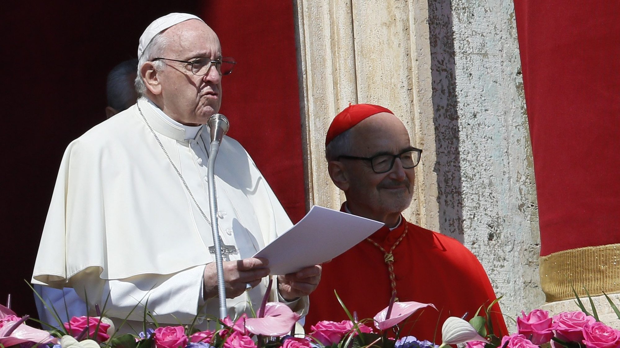 Pope Francis delivers his Easter message "urbi et orbi" (to the city and the world) from the central balcony of St. Peter's Basilica at the Vatican April 17, 2022. Also pictured is Cardinal Michael Czerny. (CNS photo/Paul Haring)