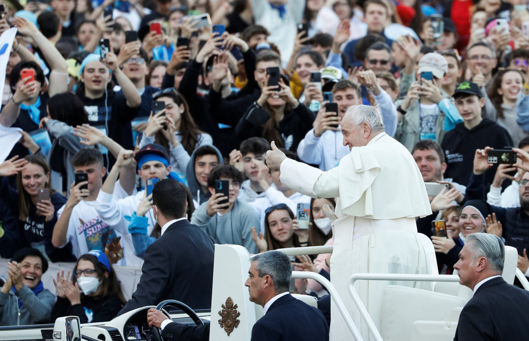 Pope Francis gives the thumbs up as he arrives for a meeting with thousands of young people taking part in a pilgrimage organized by the Italian bishops' conference in St. Peter's Square at the Vatican April 18, 2022. (CNS photo/Remo Casilli, Reuters)
