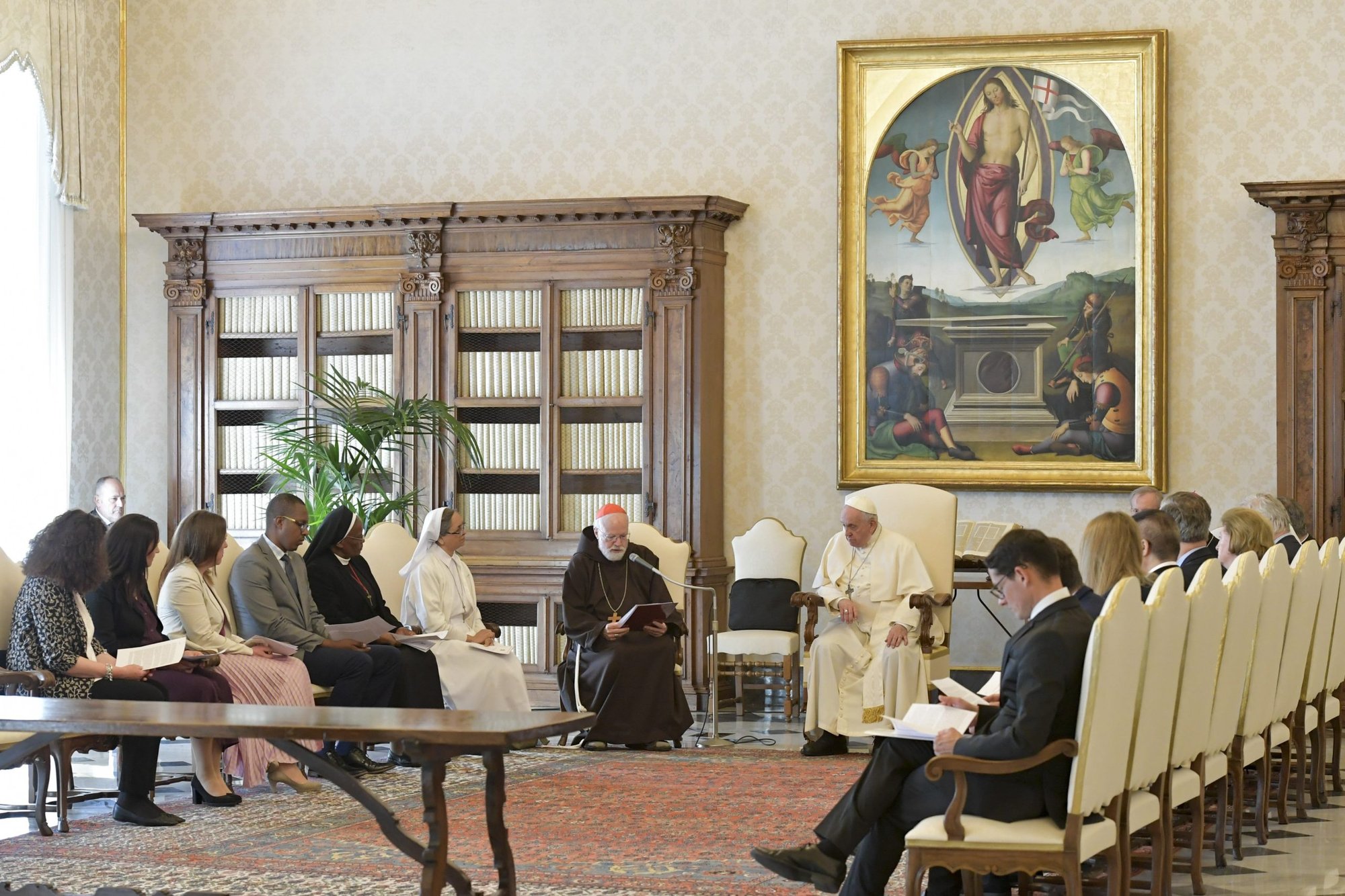 Pope Francis looks on as Boston Cardinal Seán P. O'Malley, president of the Pontifical Commission for the Protection of Minors, speaks during a meeting with commission members at the Vatican April 29, 2022. (CNS photo/Vatican Media)
