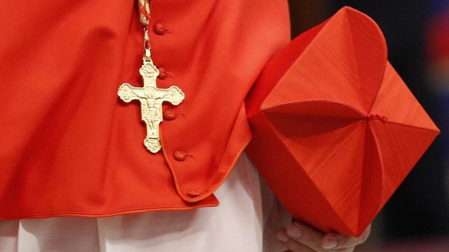 A cardinal carries his biretta as he arrives for a consistory with Pope Francis in St. Peter's Basilica at the Vatican in this June 28, 2018, file photo. (CNS photo/Paul Haring)