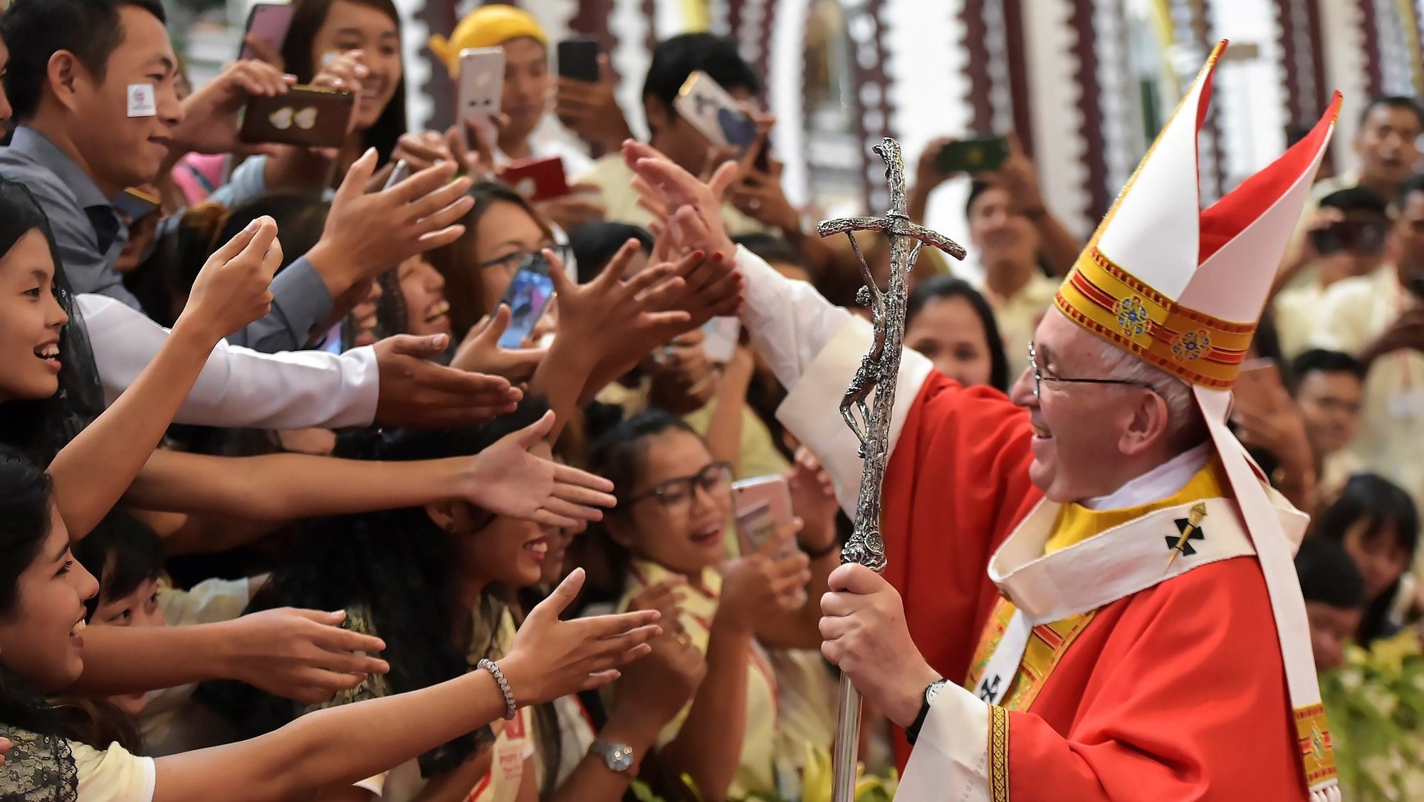 Pope Francis greets young people after celebrating Mass Nov. 30, 2017, at St. Mary's Cathedral in Yangon, Myanmar. In a video message released by the Pope's Worldwide Prayer Network May 3, 2022, Pope Francis offered his prayer intention for the month of May, which he dedicated to young people. (CNS photo/L'Osservatore Romano via Reuters)