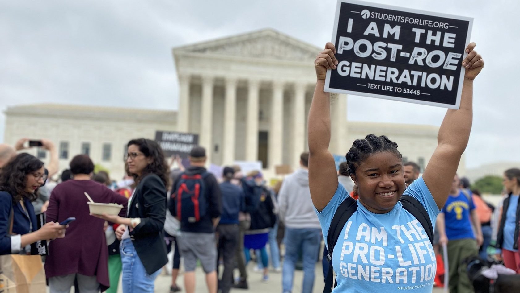 Norvilia Etienne, of Students for Life, holds a sign outside the Supreme Court of the United States May 3, 2022, the day after a draft of the court's opinion was leaked signaling that the court was leaning toward overturning Roe v. Wade. (CNS photo/Rhina Guidos)