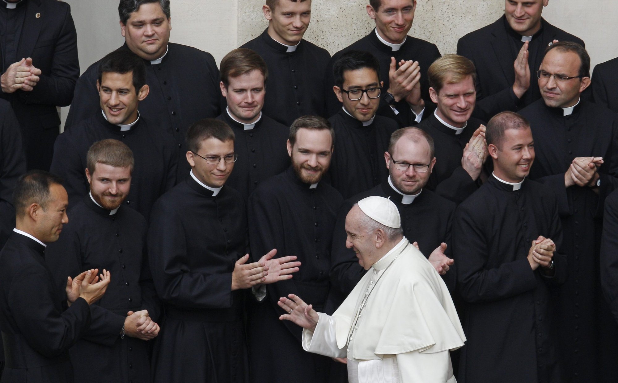 Pope Francis greets priests and seminarians from the Pontifical North American College during his general audience in the San Damaso courtyard at the Vatican in this Sept. 30, 2020, file photo. In his message for the World Day of Prayer for Vocations, the pope said that priests and laity should work together to evangelize. (CNS photo/Paul Haring)