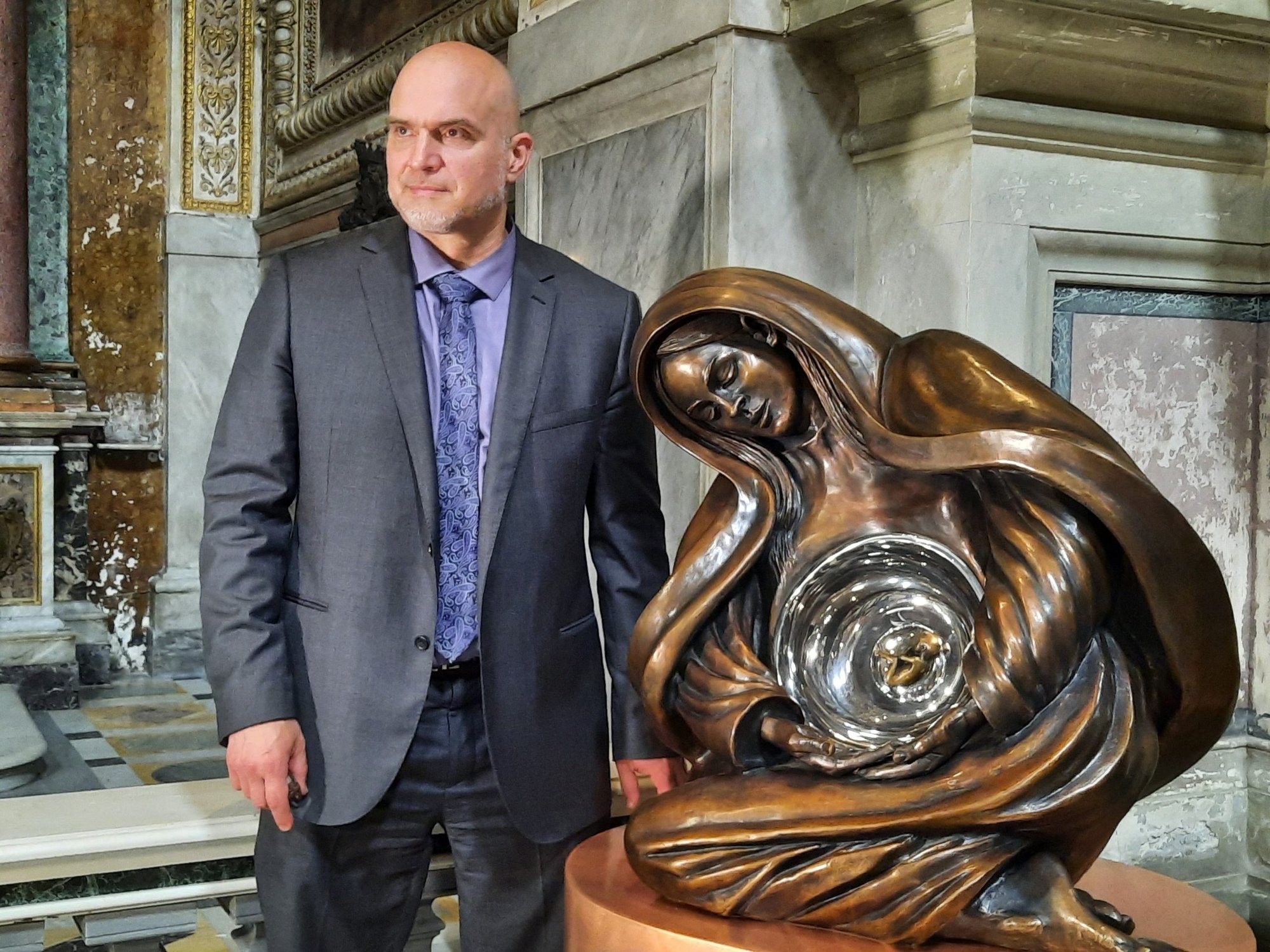 Canadian sculptor Timothy Schmalz poses before speaking to reporters in Rome May 27, 2022, to present the installation of his latest piece, "Life Monument," a bronze and steel sculpture of Mary and the unborn Jesus in her womb. The 8-foot tall sculpture is permanently installed in the center of Rome at the Church of San Marcello al Corso. A much larger replica will be installed in Washington at an unspecified date after it completes a small tour of the United States. (CNS photo/Carol Glatz)