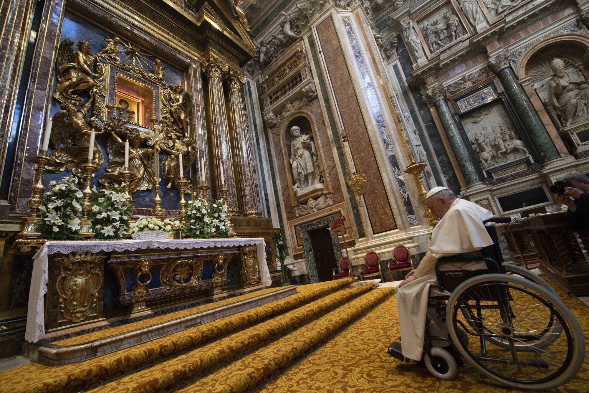 Pope Francis prays in front of the Marian icon "Salus Populi Romani" during a visit to pray the rosary at the Basilica of St. Mary Major in Rome May 31, 2022. The pope prayed for peace of in front of the basilica's statue of Mary, Queen of Peace, as he closed the Marian month of May. (CNS photo/Vatican Media)