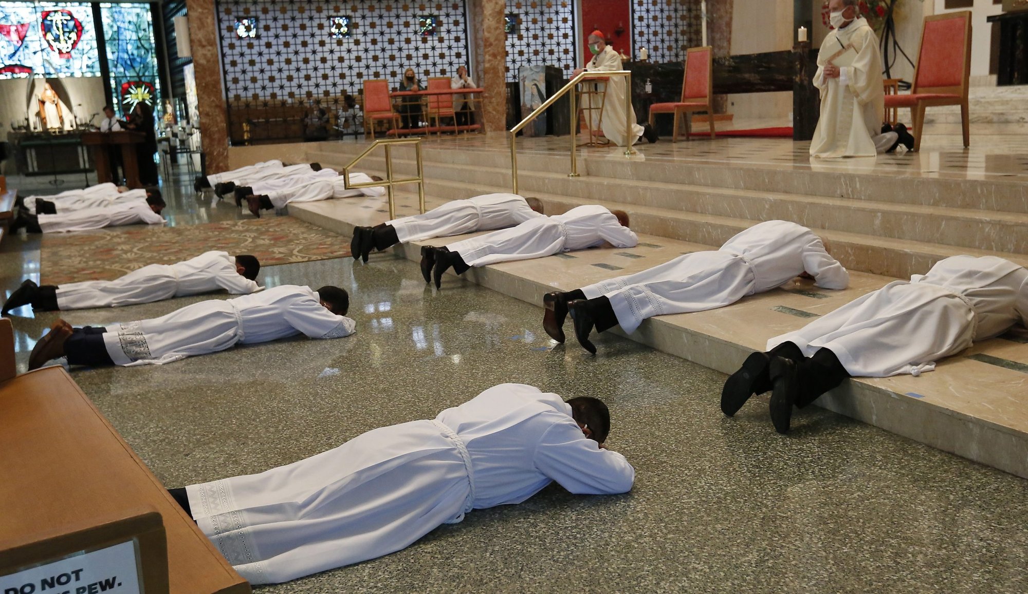 Men lie prostrate during their ordination to the diaconate at St. Rita of Cascia Shrine Chapel in Chicago Sept. 26, 2020. (CNS photo/Karen Callaway, Chicago Catholic)
