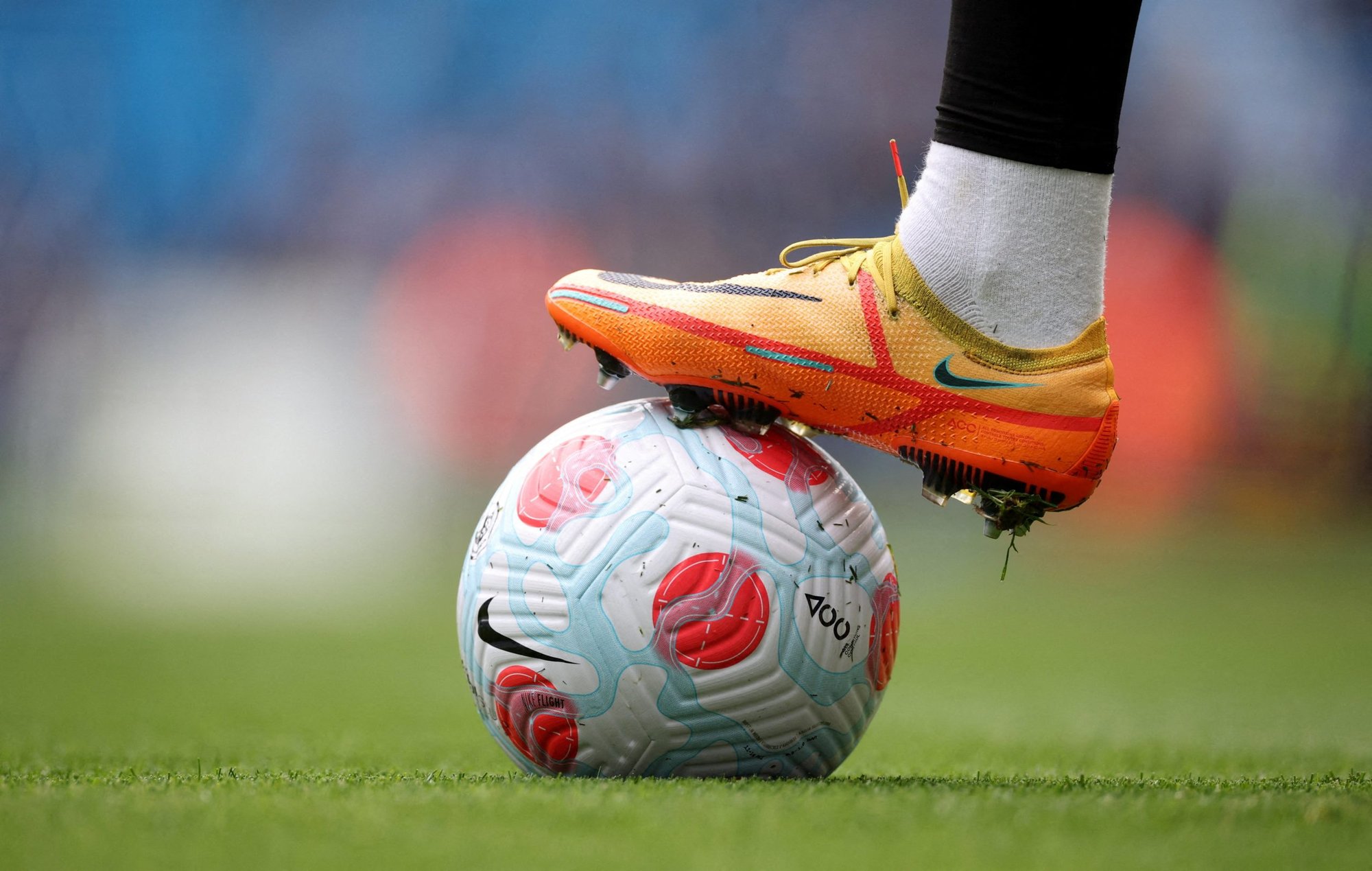 A soccer ball and a player's cleat are pictured in a photo illustration. Catholic priests from dioceses across Vietnam will compete in the first-ever national soccer championship to promote the spirit of synodality, reported ucanews.com. The National Synodal Cup 2022-23 will be in July and October. (CNS photo/Phil Noble, Reuters)