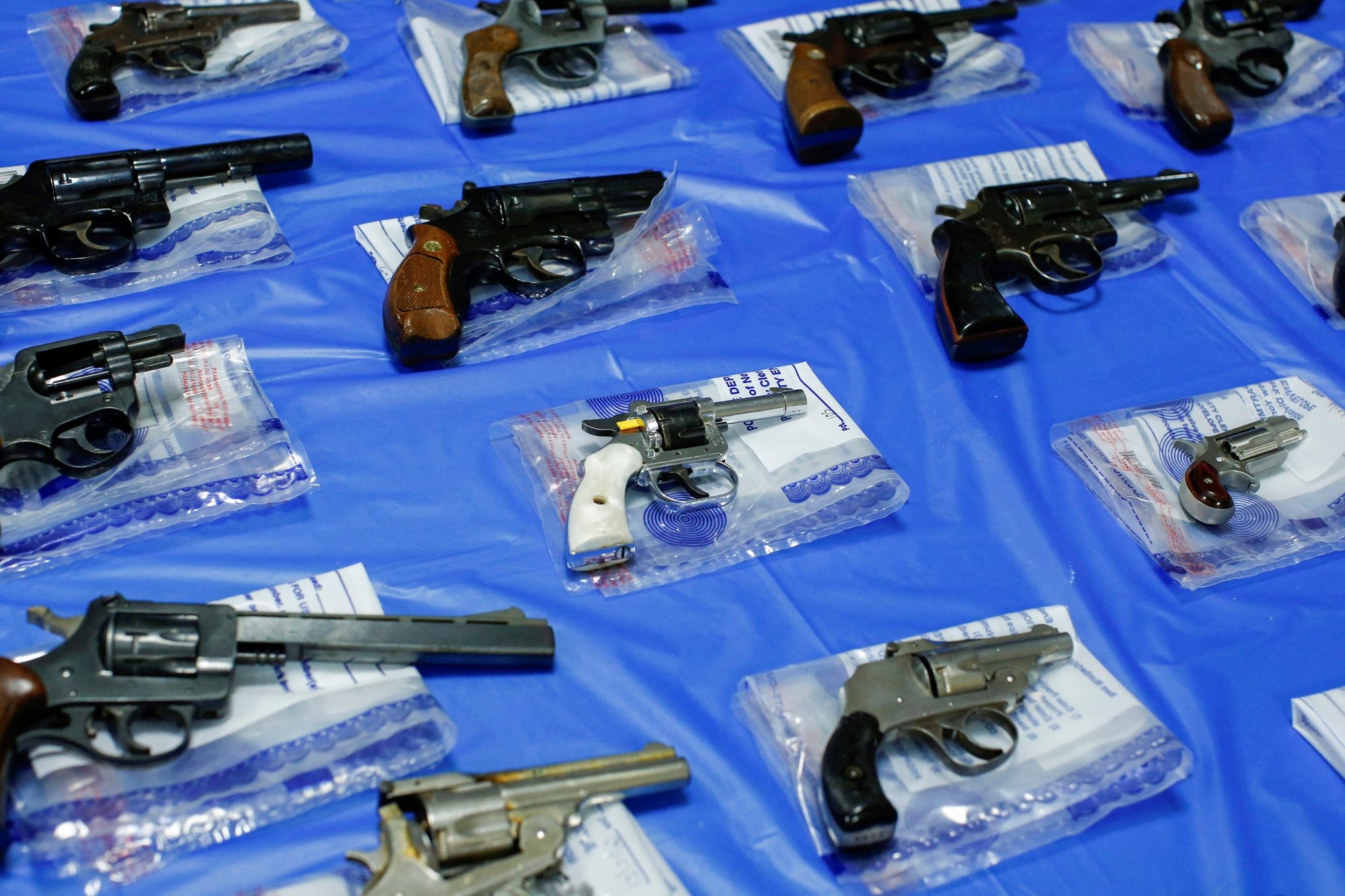 Guns are displayed in the Queens borough of New York City June 12, 2021, after a gun buyback event organized by the New York City Police Department. In a decision issued June 23, 2022, the U.S. Supreme Court ruled 6-3 to limit state and local governments from restricting people's ability to carrying guns outside the home. (CNS photo/Eduardo Munoz, Reuters)