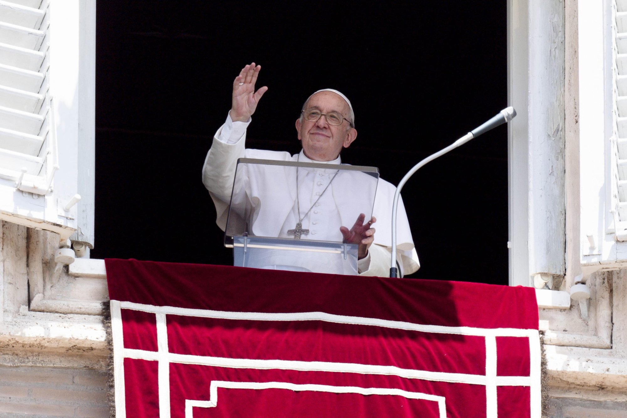 Pope Francis greets the crowd as he leads the Angelus from the window of his studio overlooking St. Peter's Square at the Vatican June 26, 2022. (CNS photo/Vatican Media)