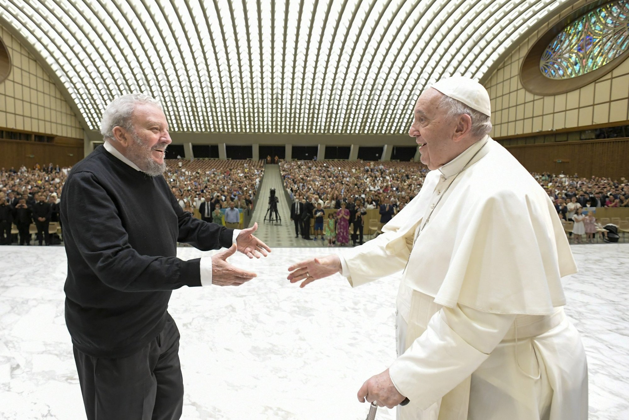 Pope Francis greets Kiko Argüello, co-founder of the Neocatechumenal Way, during an audience in the Paul VI hall at the Vatican June 27, 2022. The movement was preparing to send priests and 450 families on evangelization missions to every continent. (CNS photo/Vatican Media)
