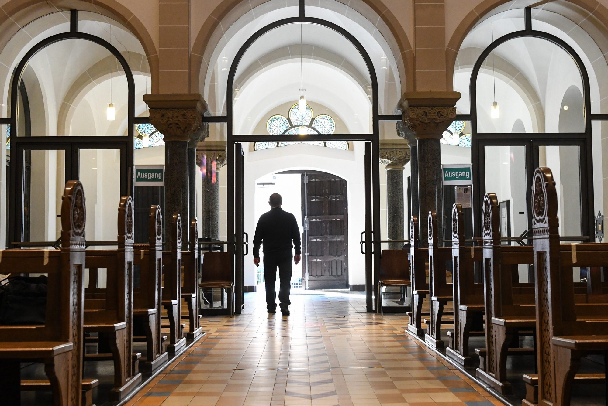 A man leaves an empty church in Bonn Germany, June 12, 2020, during the COVID-19 pandemic. The number of people resigning from membership in the Catholic Church has hit a new record in Germany in 2022. (CNS photo/Harald Oppitz, Reuters)