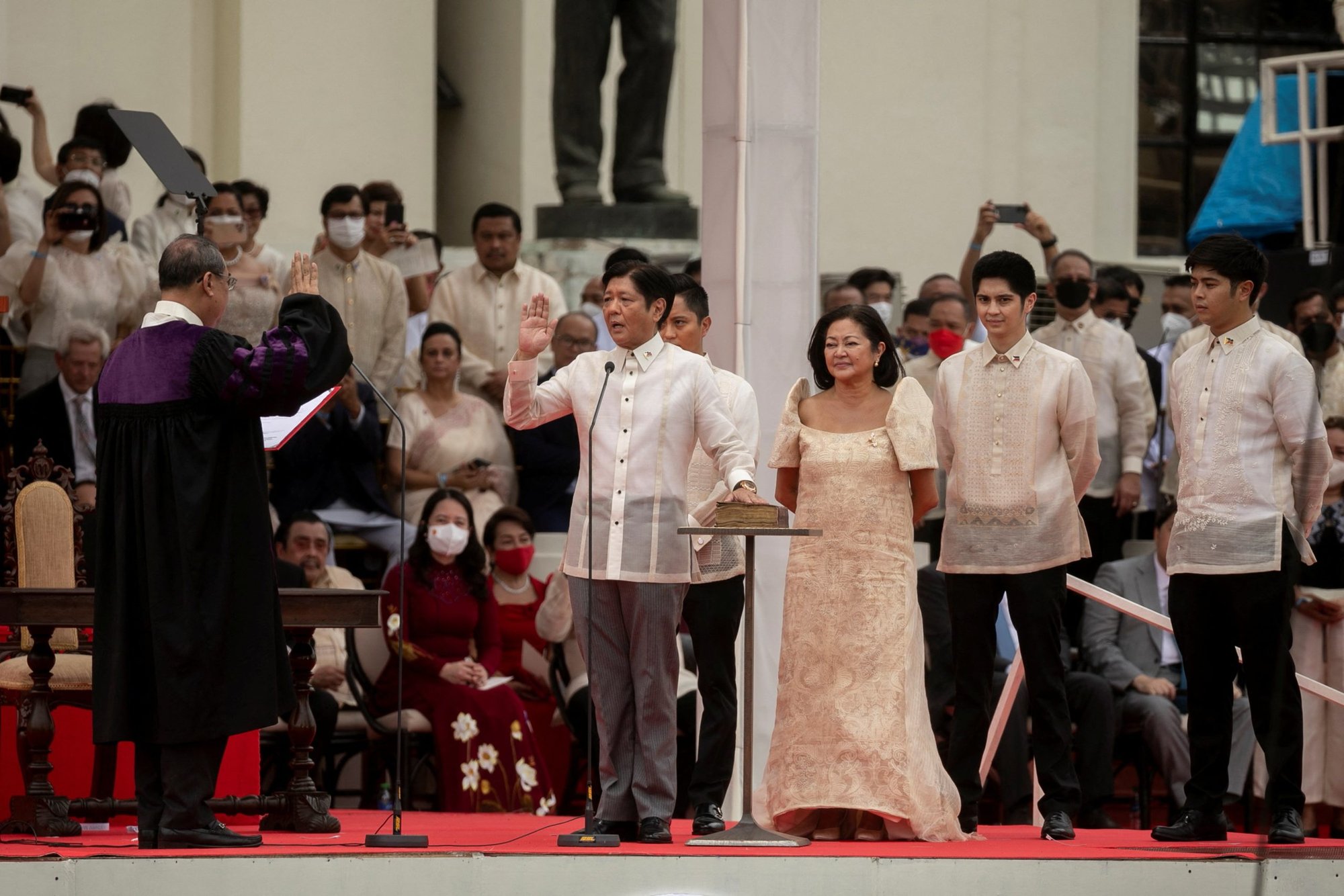 Ferdinand "Bongbong" Marcos Jr., the son and namesake of the late dictator Ferdinand Marcos Sr., takes the oath of office beside his wife, Louise Araneta-Marcos, during the inauguration ceremony at the National Museum in Manila, Philippines, June 30, 2022. (CNS photo/Eloisa Lopez, Reuters)
