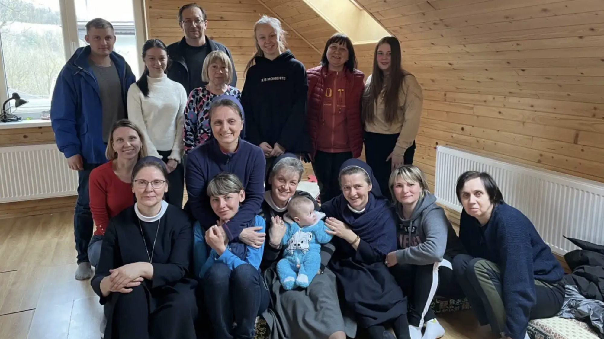 Sister Dolores Zok, bottom left, with some Ukrainian displaced people who stayed with her congregation after fleeing their country. (Sister Dolores Zok via Crux)