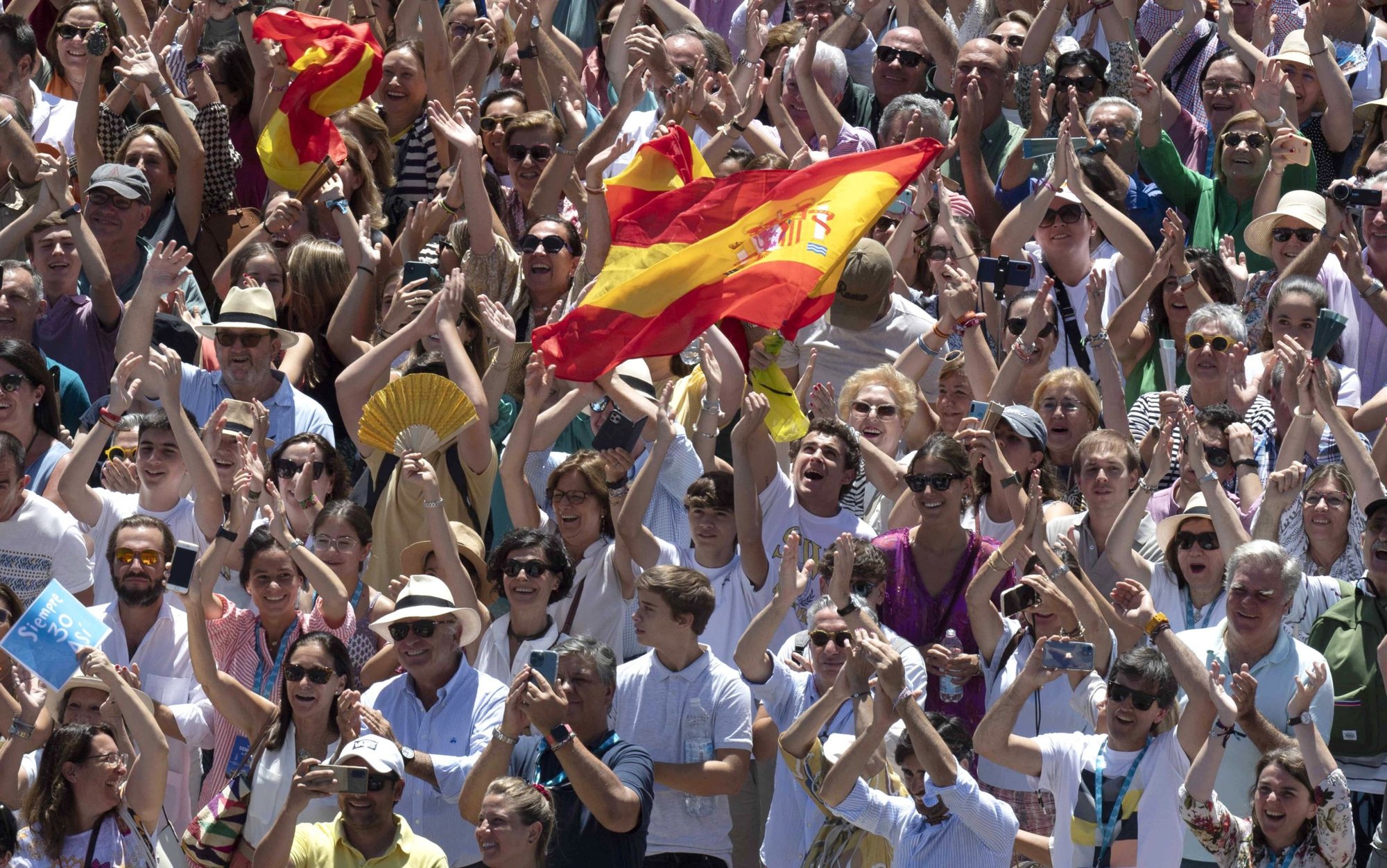 People in St. Peter's Square cheer as Pope Francis leads the Angelus from the window of his studio overlooking the square at the Vatican July 10, 2022. In his remarks the pope said the parable of the good Samaritan is a call for Christians to "have compassion on those whom we encounter along the way, above all on those who suffer and are in need." (CNS photo/Vatican Media)