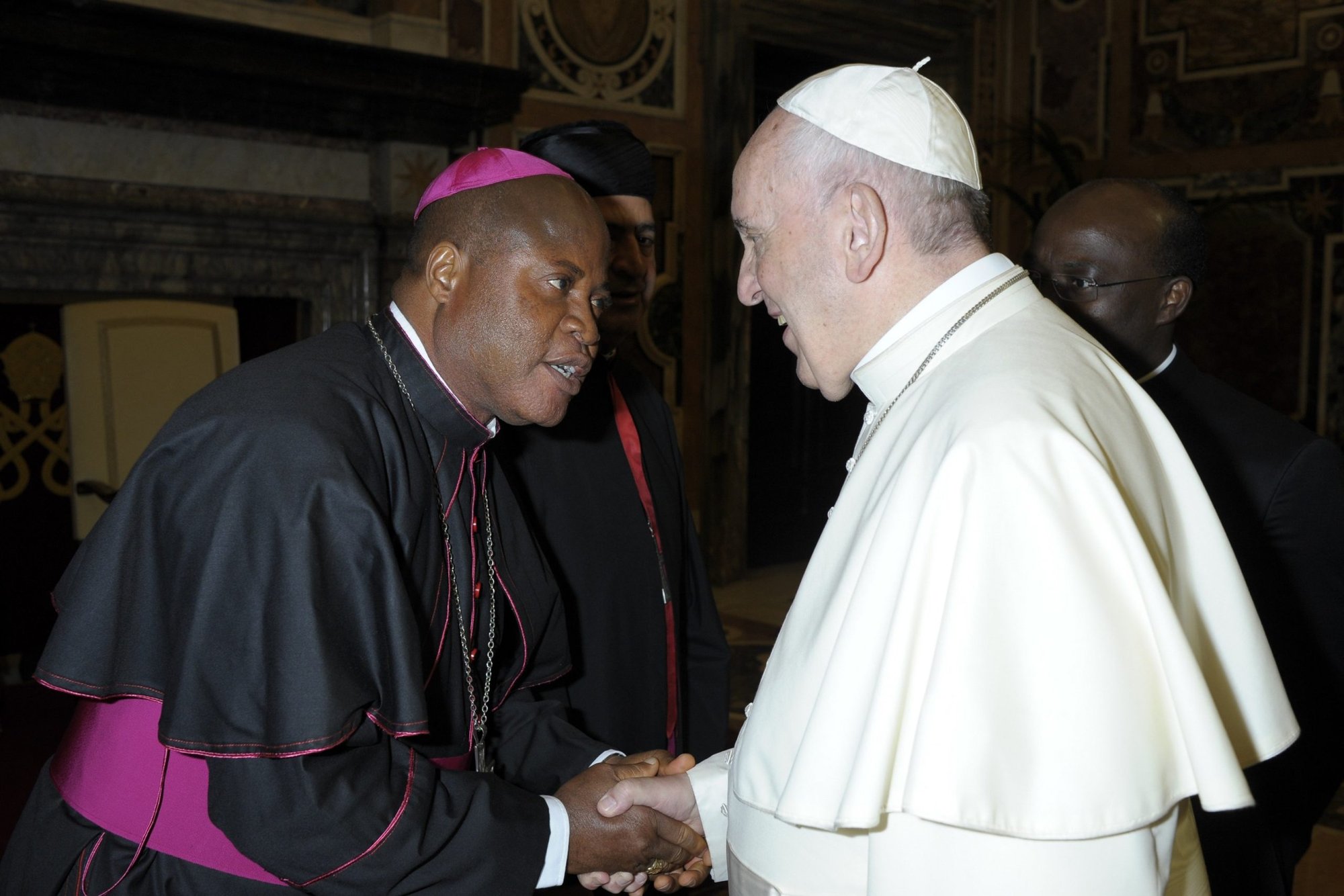 Bishop Peter Ebere Okpaleke of Ekwulobia, Nigeria, greets Pope Francis during a meeting with Nigerian bishops at the Vatican on April 28, 2018. (CNS photo/Vatican Media)