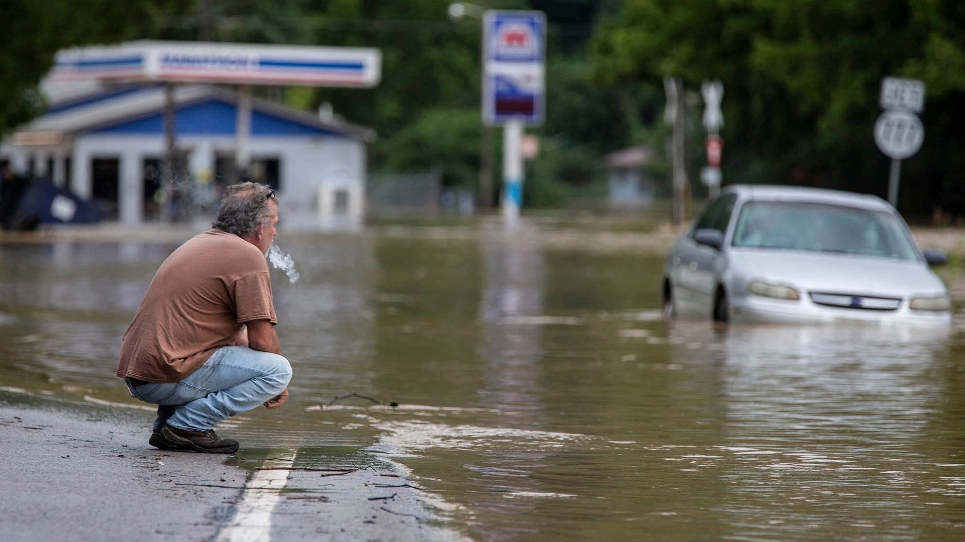 Van Jackson is seen by floodwaters along Right Beaver Creek July 28, 2022, following a day of heavy rain in in Garrett, Ky. (CNS photo/Pat McDonogh, USA TODAY NETWORK via Reuters)