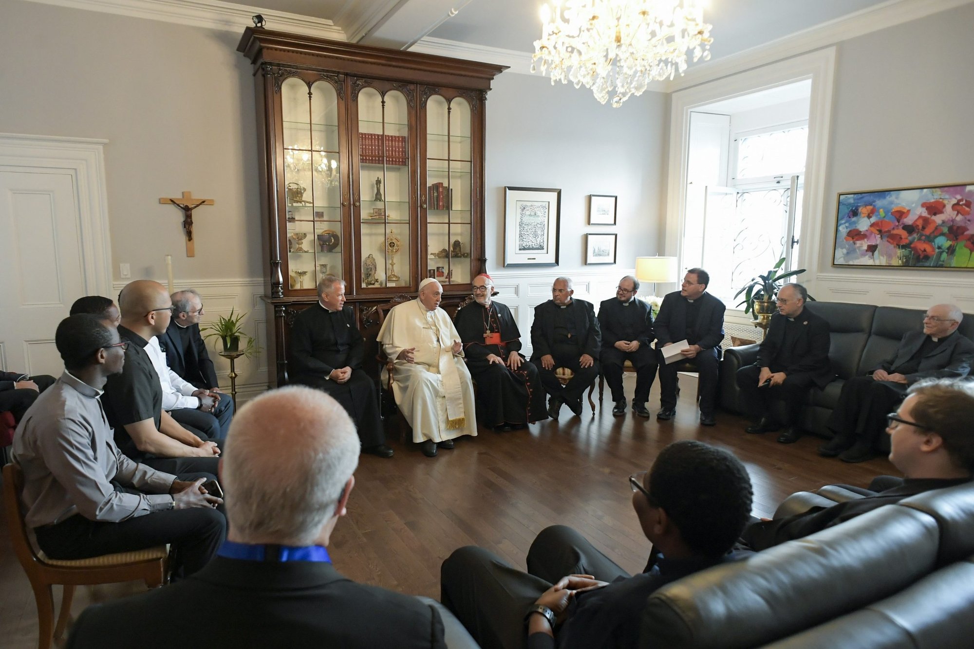 Pope Francis meets with Jesuits working in Canada during a meeting at the archbishop's residence in Quebec July 29, 2022. Pictured with the group is Cardinal Michael Czerny, prefect of the Dicastery for Promoting Integral Human Development. (CNS photo/Vatican Media)