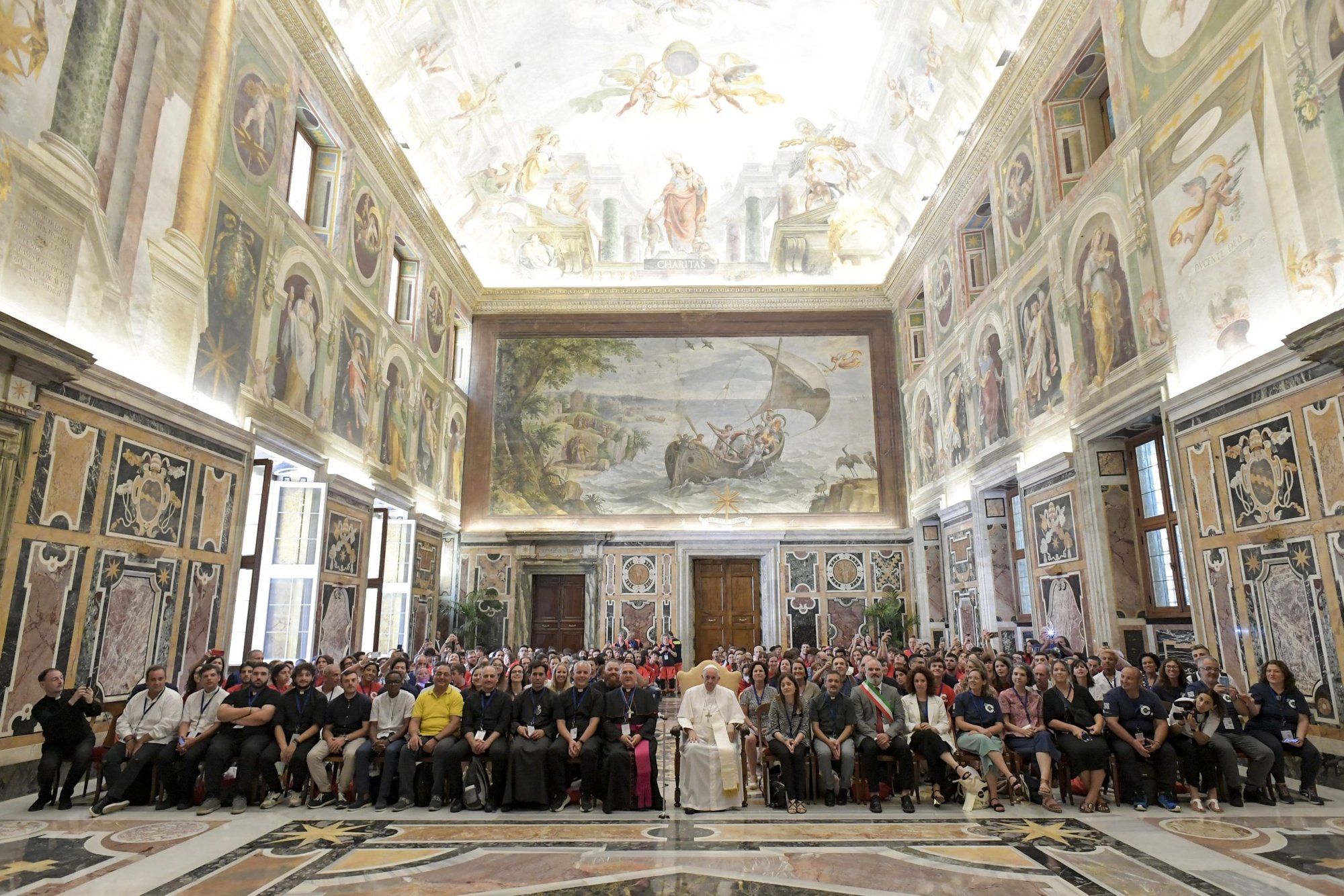 Pope Francis is pictured with young people participating in a summer camp program sponsored by Alpha International during an audience at the Vatican Aug. 5, 2022. (CNS photo/Vatican Media)