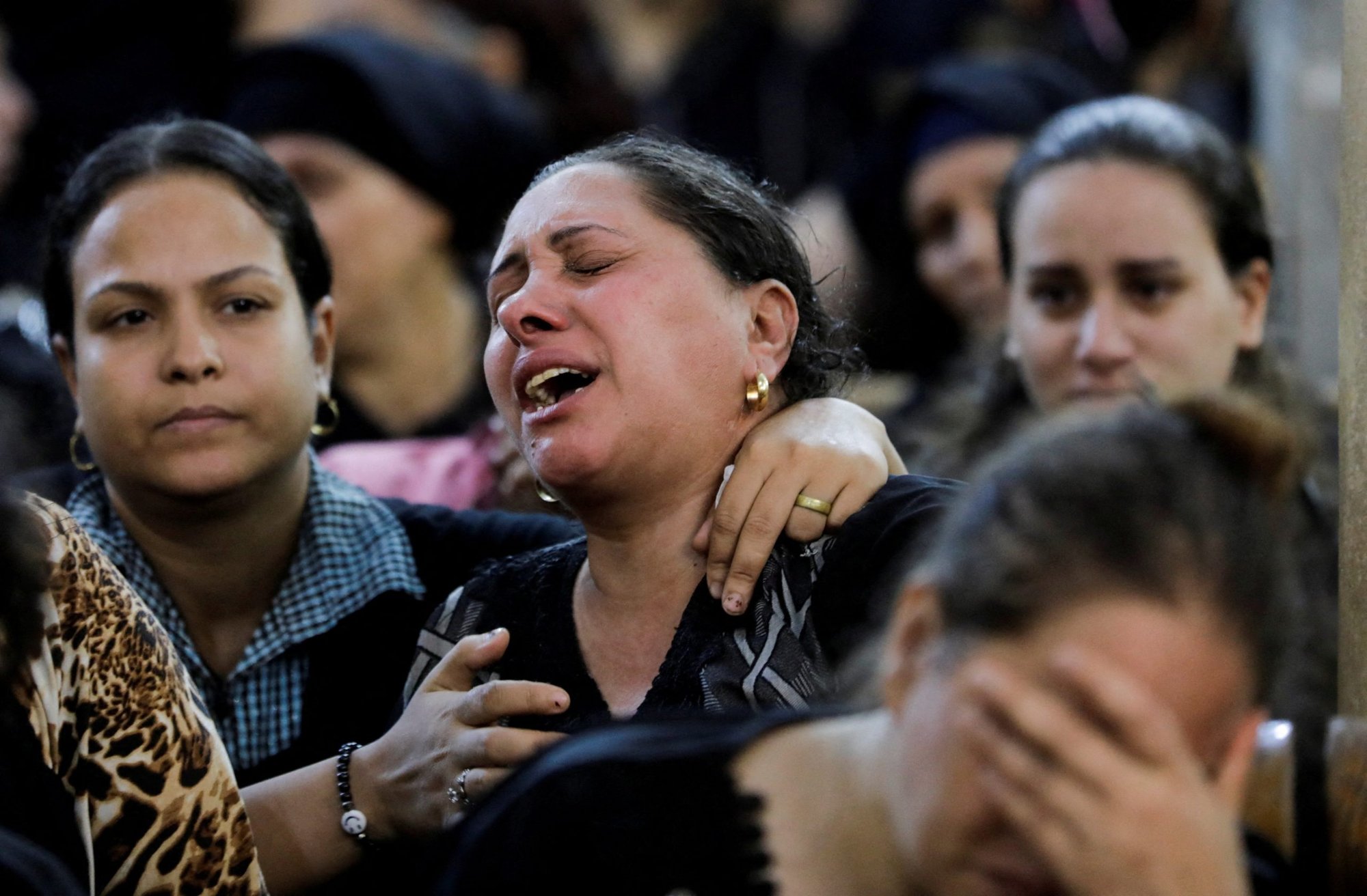A woman reacts during the funeral of victims who died in the fire that broke out at the Martyr Abu Sefein Orthodox Church. The funeral was at the Church of the Blessed Virgin Mary at Warraq Al Arab district in Giza Governorate, Egypt, Aug. 14, 2022. (CNS photo/Mohamed Abd El Ghany, Reuters)