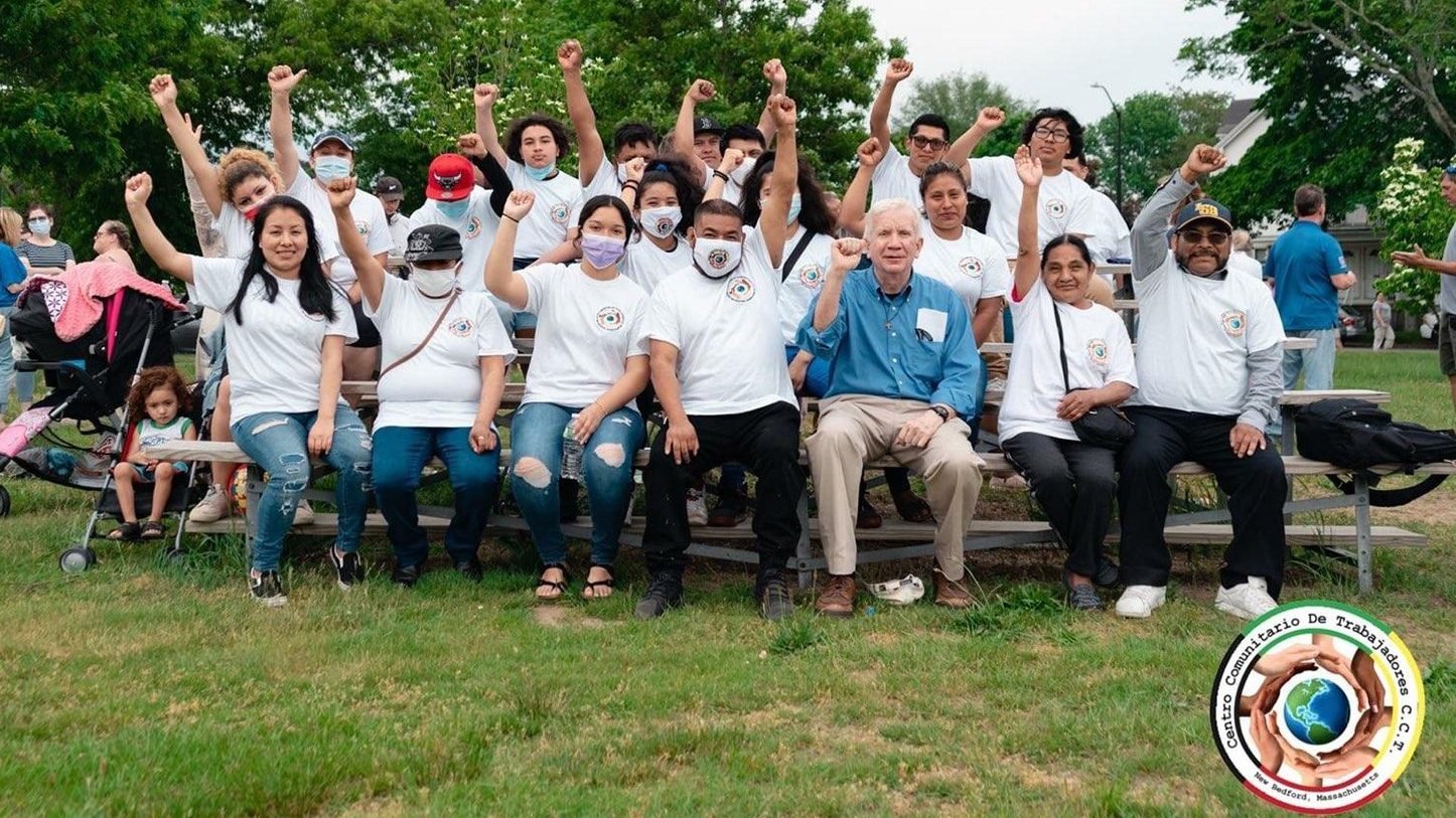 Members of the Centro Comunitario de Trabajadores in New Bedford, Mass., raise their fist in the air in this undated photo. The center, which began with a grant from the Catholic Campaign for Human Development in 2019, has become the go-to place for vulnerable workers and tends to Indigenous communities from Central America who work in the fishing industries. (CNS photo/courtesy Father Marc Fallon)