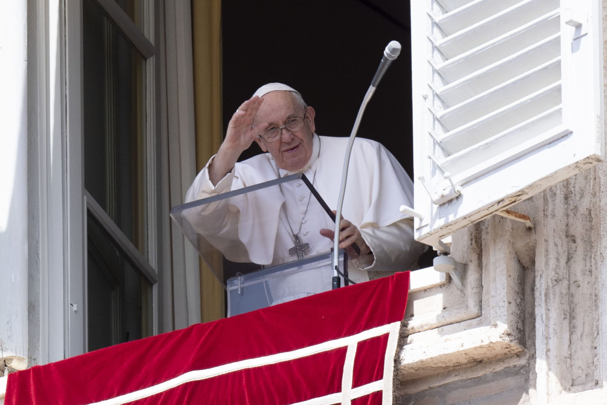 Pope Francis greets the crowd as he leads the Angelus from the window of his studio overlooking St. Peter's Square at the Vatican Aug. 22, 2022. (CNS photo/Vatican Media)