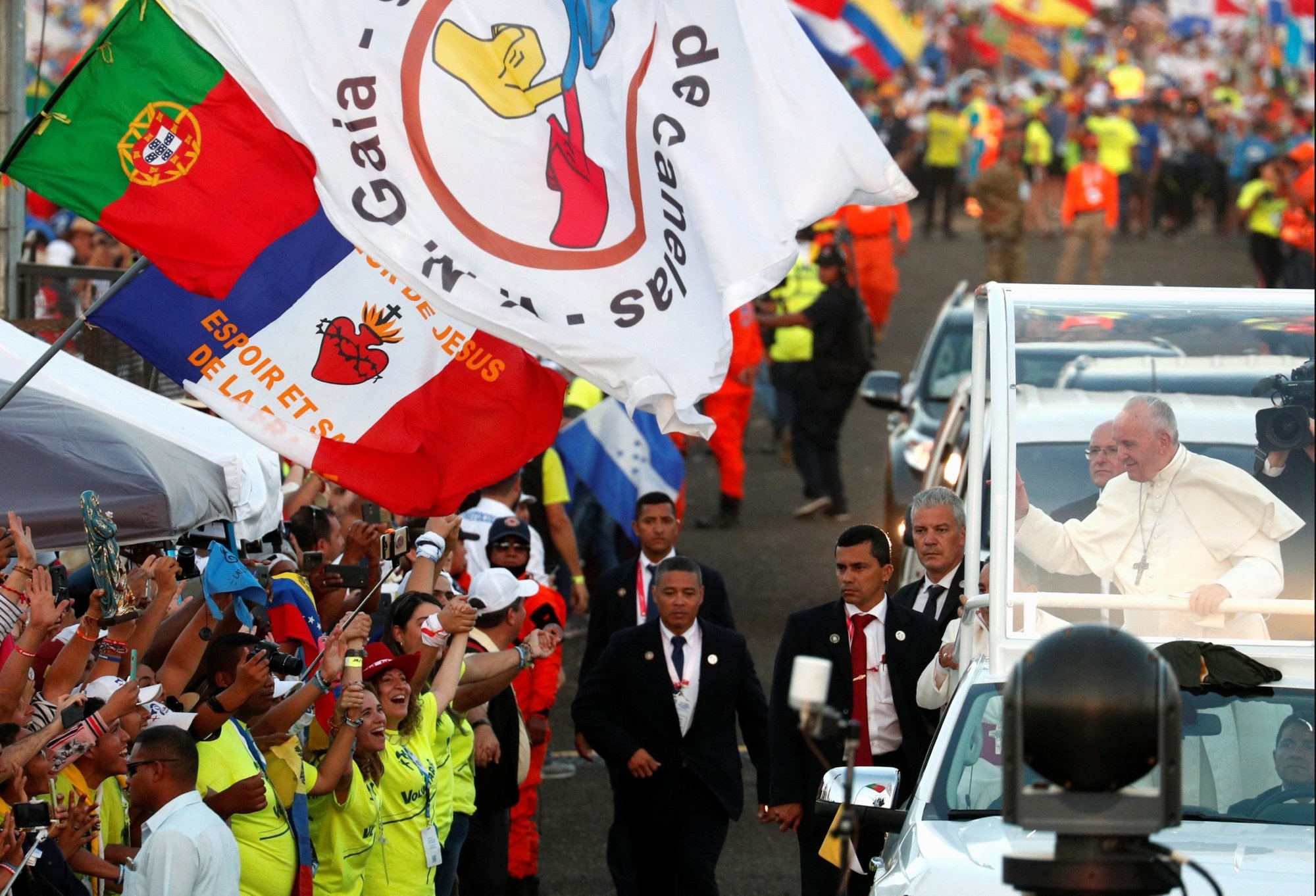 A Portuguese flag is seen near Pope Francis as he greets the crowd before celebrating Mass for World Youth Day pilgrims at St. John Paul II Field in Panama City Jan. 27, 2019. World Youth Day in Lisbon, Portugal, will be during the first week of August 2023, the Vatican announced. (CNS photo/Alessandro Bianchi, Reuters)