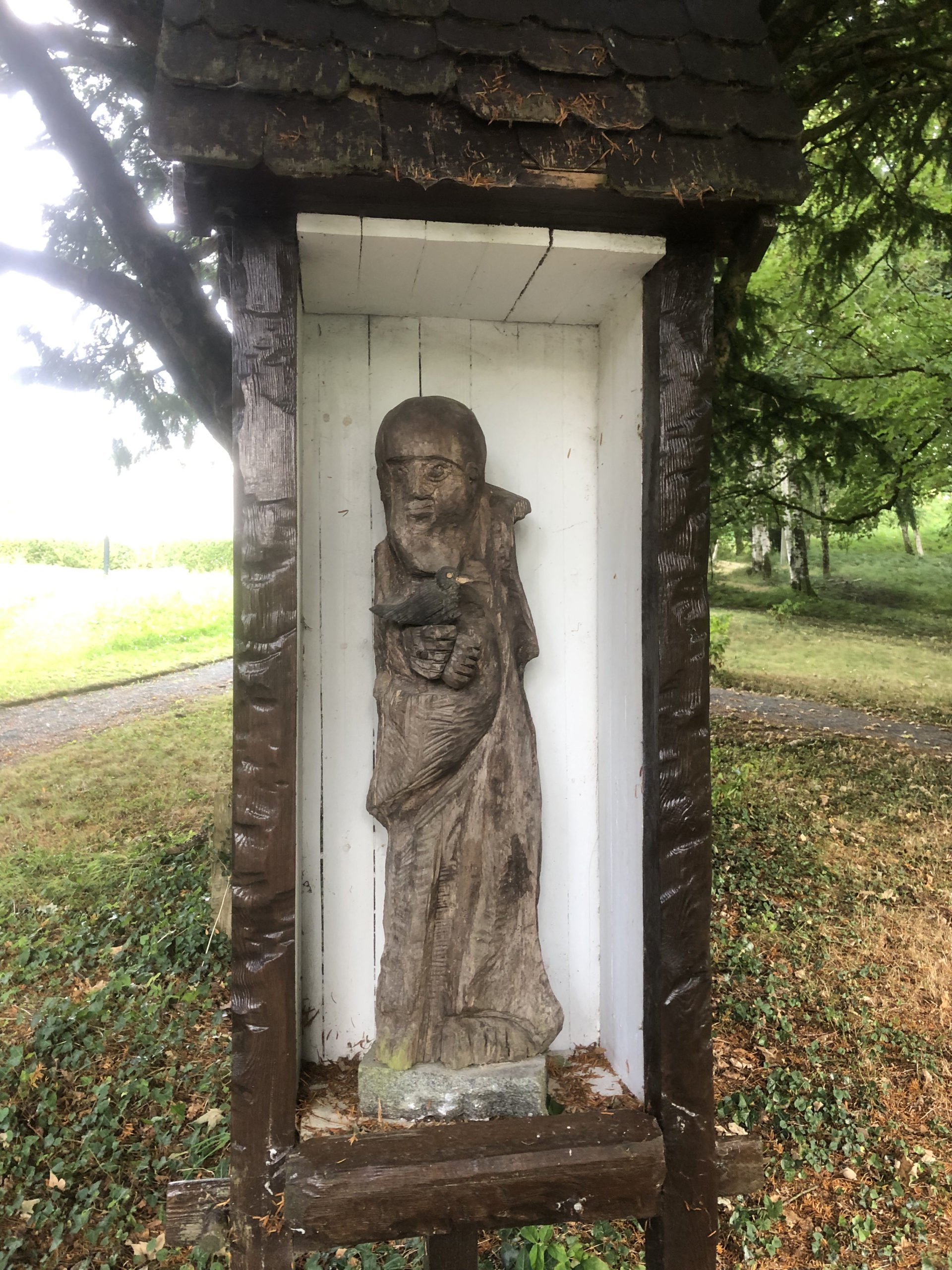 A sculpture of St. Kevin, by Fergus O'Farrell, in the garden at St. Kevin Church in Glendalough Hermitage. (Heather King)