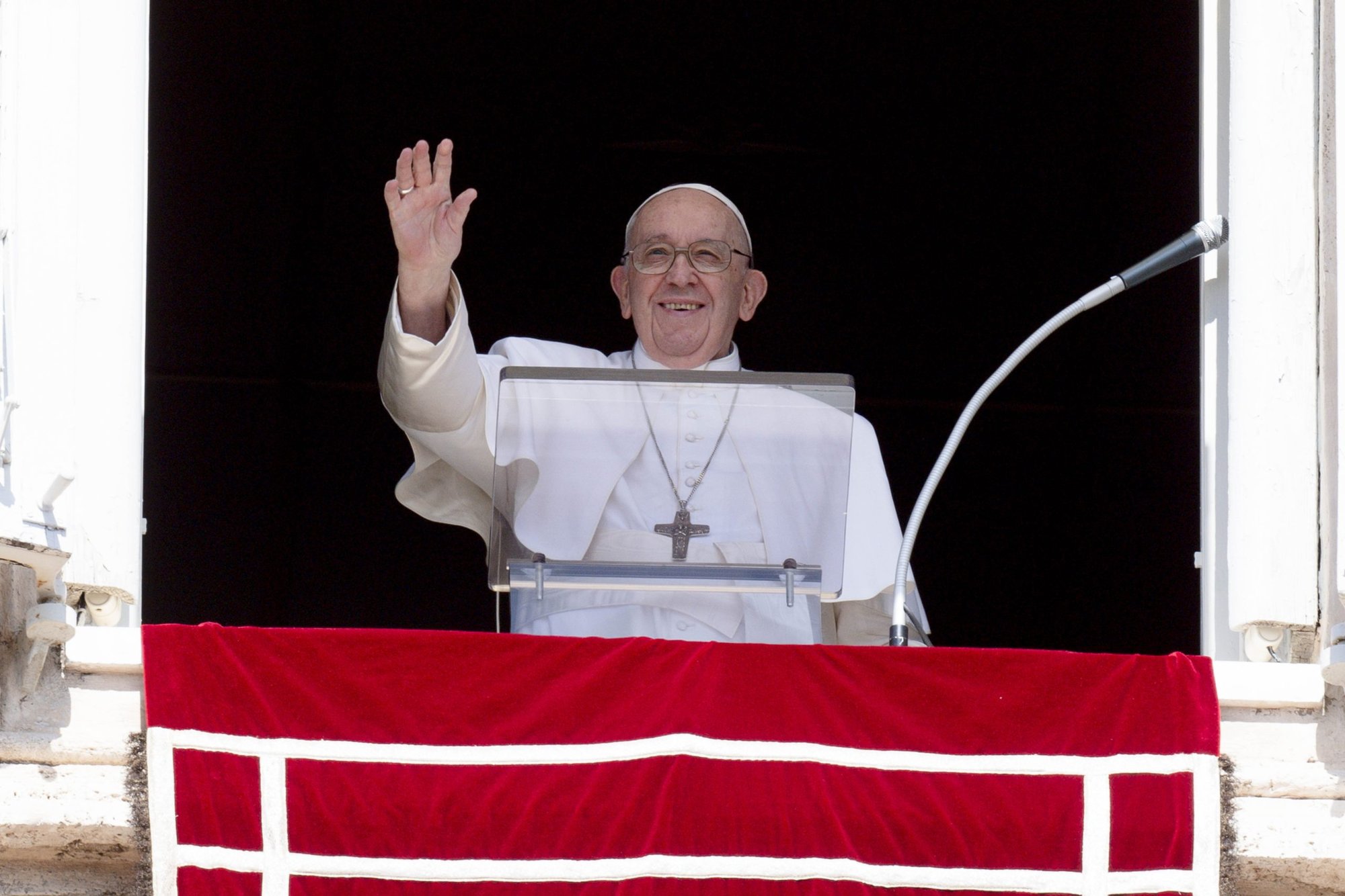 Pope Francis greets the crowd as he leads the Angelus from the window of his studio overlooking St. Peter's Square at the Vatican Sept. 11, 2022. (CNS photo/Vatican Media)