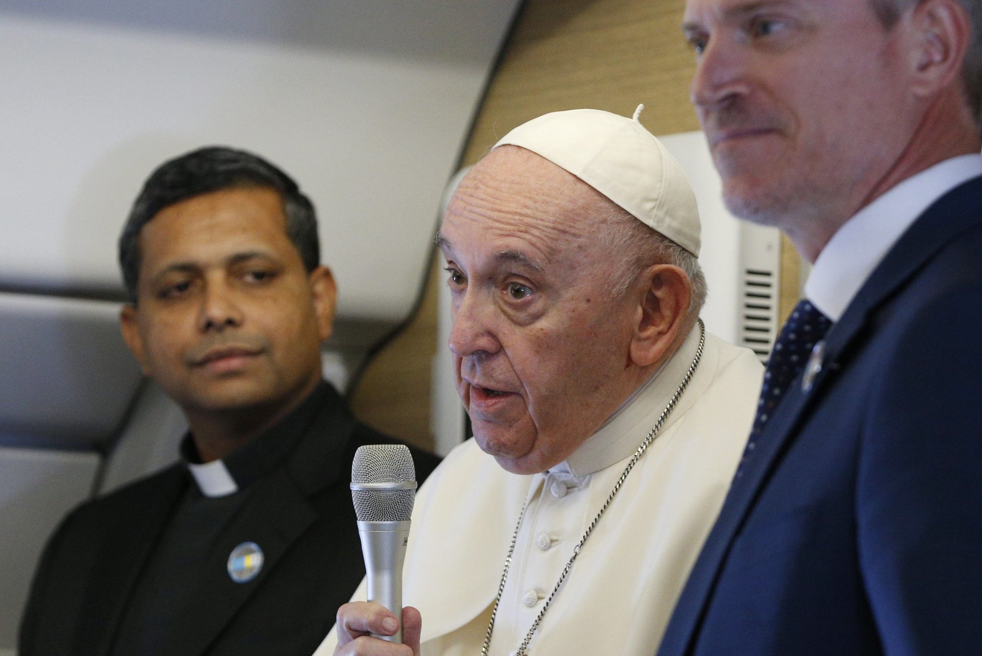 Pope Francis speaks as he greets journalists aboard his flight from Rome to Nur-Sultan, Kazakhstan, Sept. 13, 2022. The pope is visiting Kazakhstan to attend the Congress of Leaders of World and Traditional Religions. (CNS photo/Paul Haring)