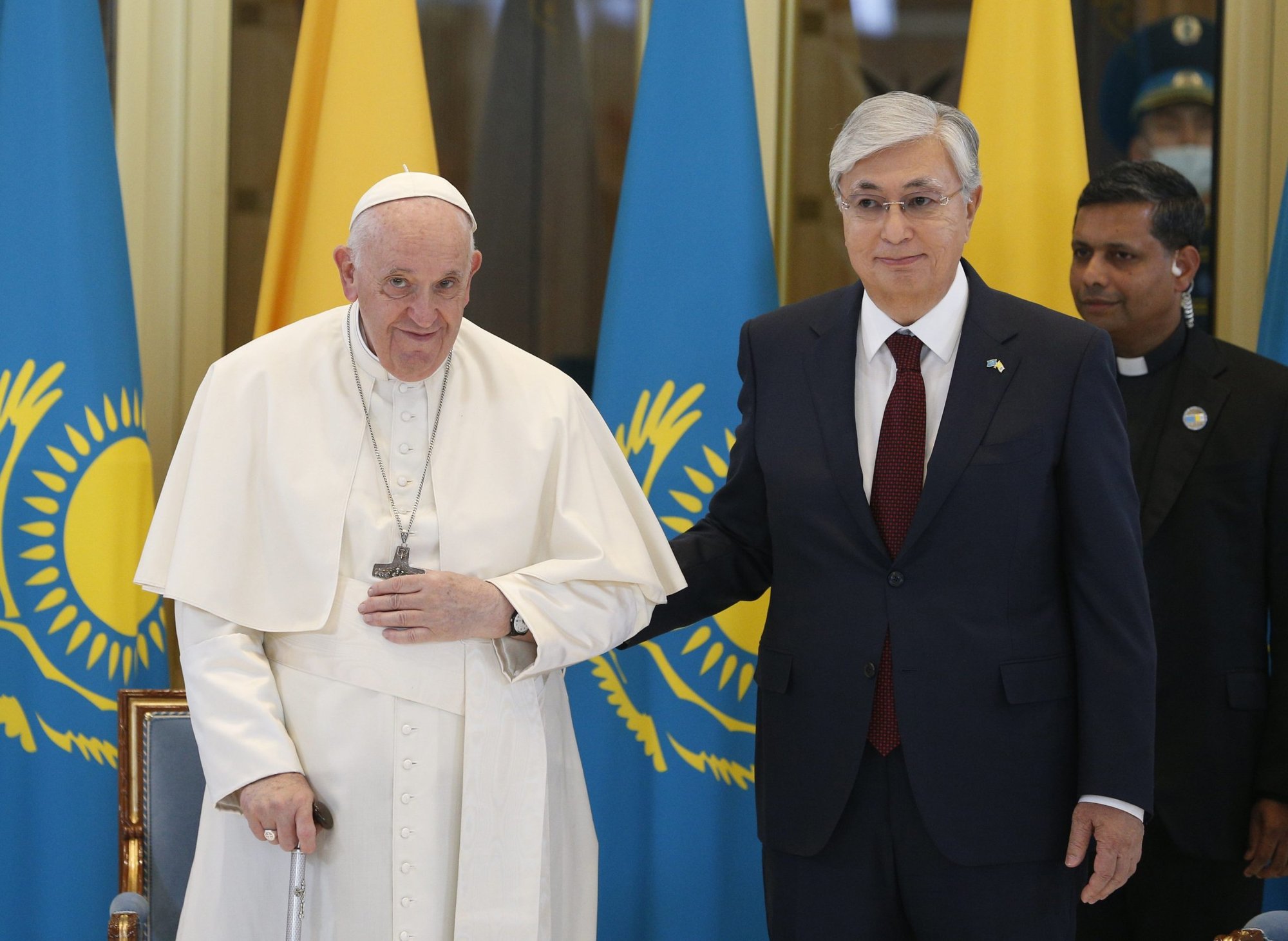 Pope Francis is welcomed by Kazakh President Kassym-Jomart Tokayev as he arrives at the international airport in Nur-Sultan, Kazakhstan, Sept. 13, 2022. The pope is attending the Congress of Leaders of World and Traditional Religions in Nur-Sultan. (CNS photo/Paul Haring)