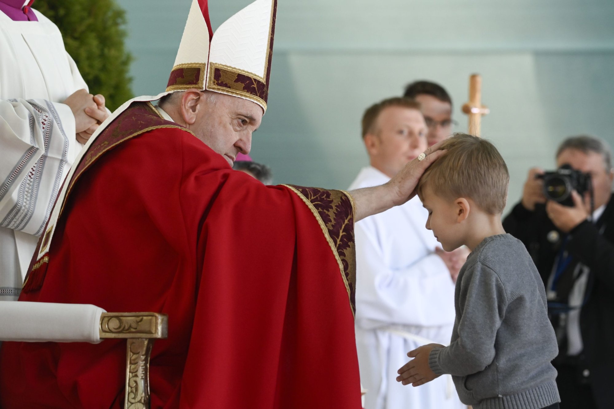 Pope Francis blesses a boy as he celebrates Mass at the Expo grounds in Nur-Sultan, Kazakhstan, Sept. 14, 2022. (CNS photo/Vatican Media)