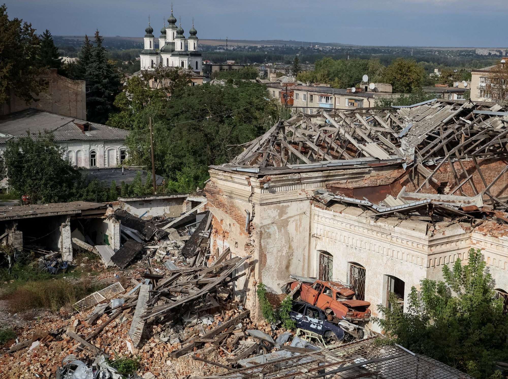 Destroyed houses and cars are seen in Izium, recently liberated by Ukrainian Armed Forces, in the Kharkiv region of Ukraine, Sept. 20, 2022. (CNS photo/Gleb Garanich, Reuters)