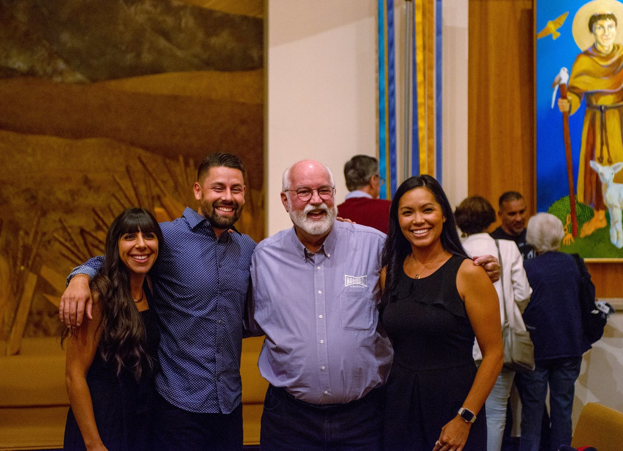 Jesuit Father Greg Boyle, founder of Homeboy Industries in Los Angeles, center, poses for a photo with Fully Liberated Youth co-founders Natalie Baddour and Preston Adams, left, and Francine Adams, Preston's wife, at Jesuit-run Regis University in Denver Sept. 9, 2022. (CNS photo/Jacob Garcia via Regis University)