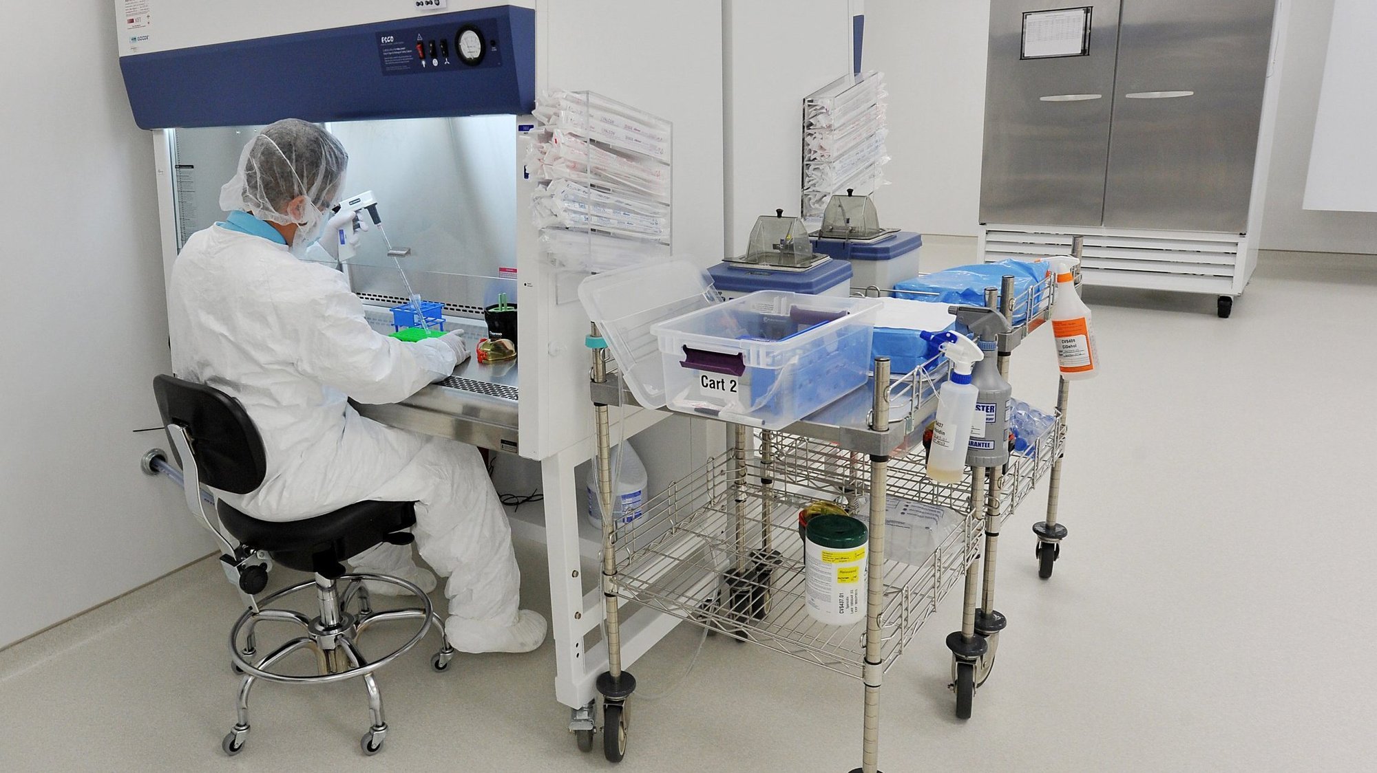 Michael Gazzia, biological manufacturing analyst, is pictured in a file photo working under the hood inside a "clean room" at a regenerative medicine facility in Clearwater, Fla. (CNS photo/Tim Boyles, courtesy Catholic Health Association)