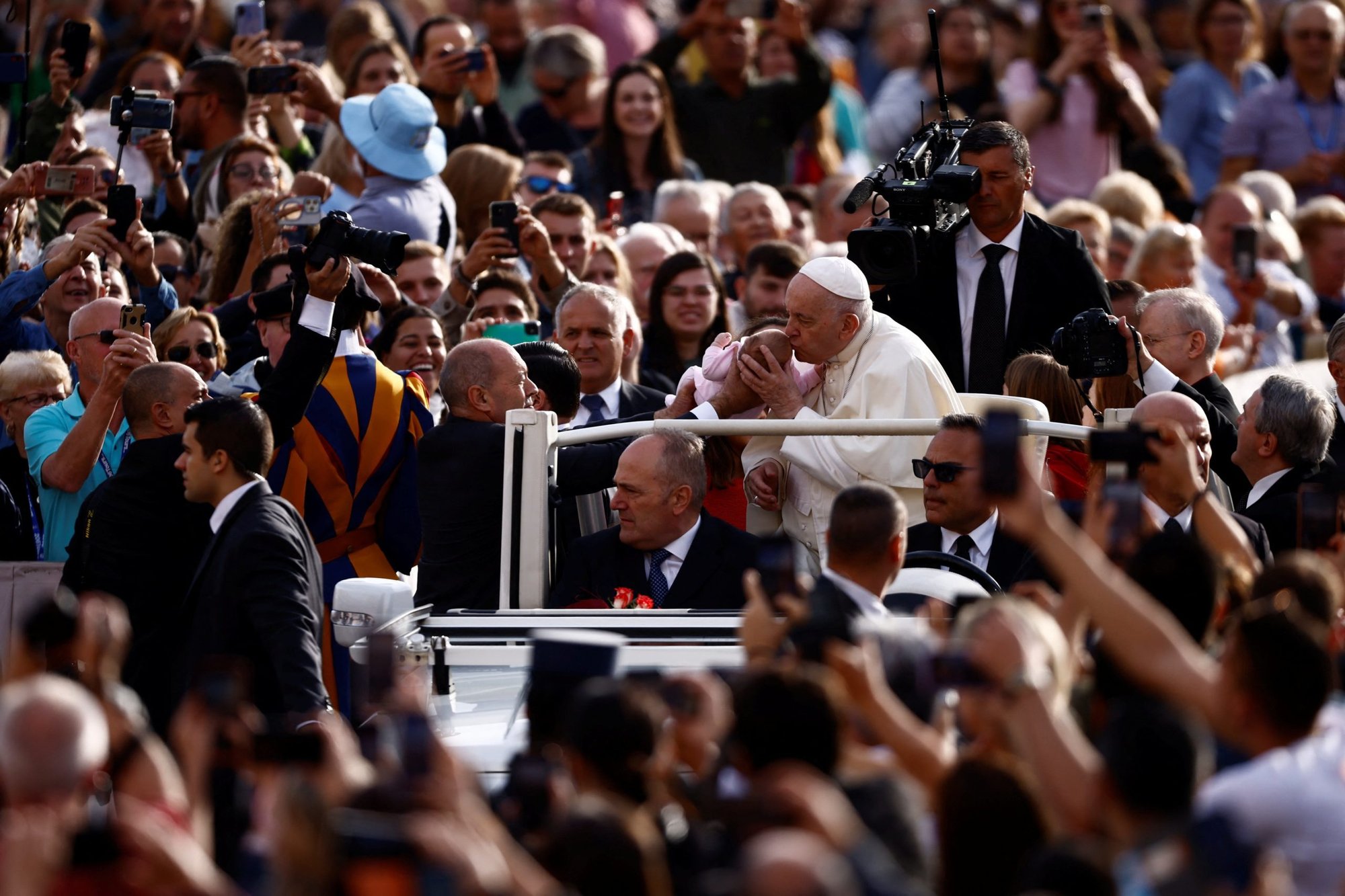 Pope Francis kisses a baby during his general audience in St. Peter's Square at the Vatican Sept. 28, 2022. (CNS photo/Yara Nardi, Reuters)