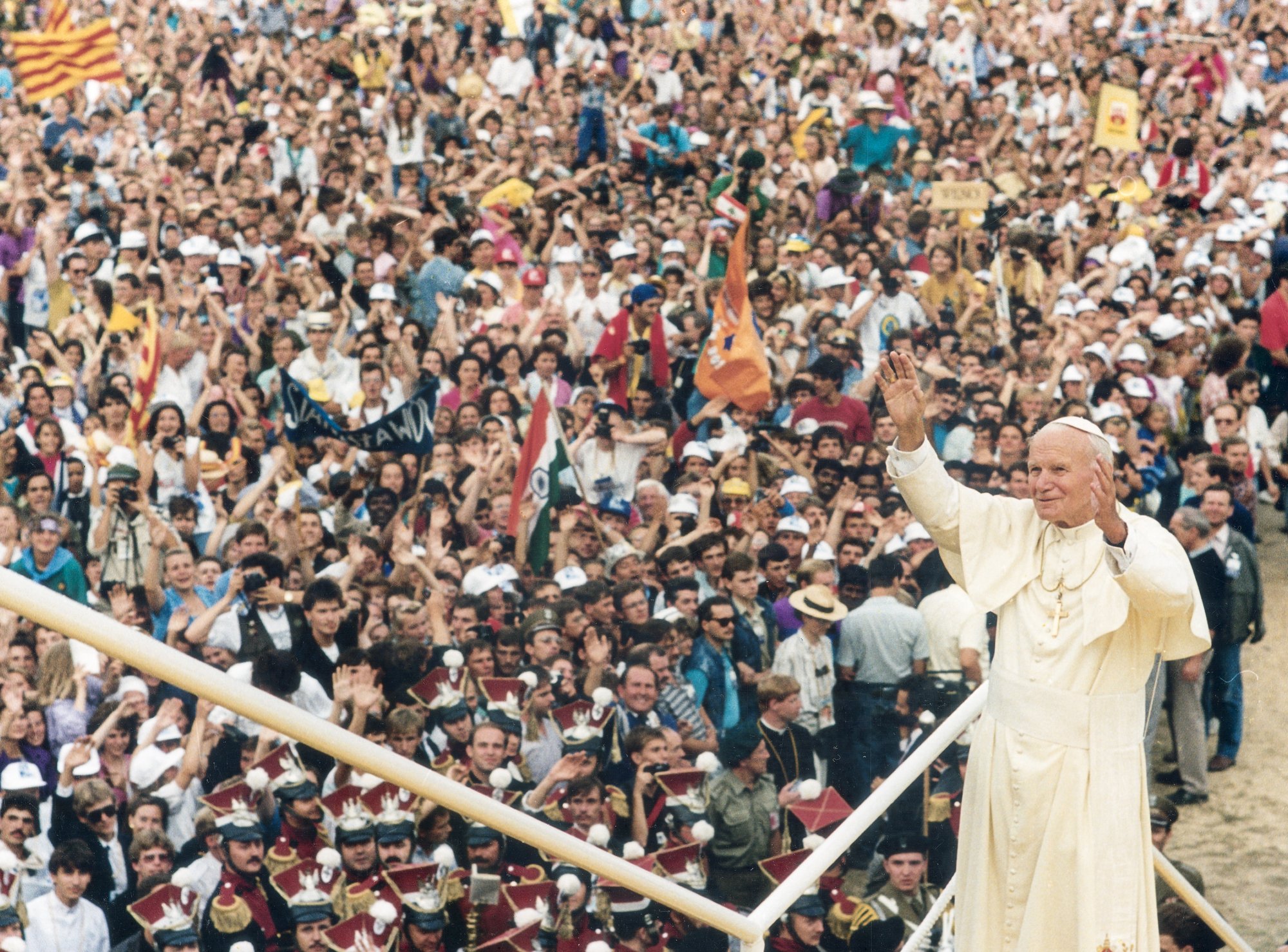 St. Pope John Paul II greets the World Youth Day crowd in Czestochowa, Poland, in 1992. (CNS file photo)
