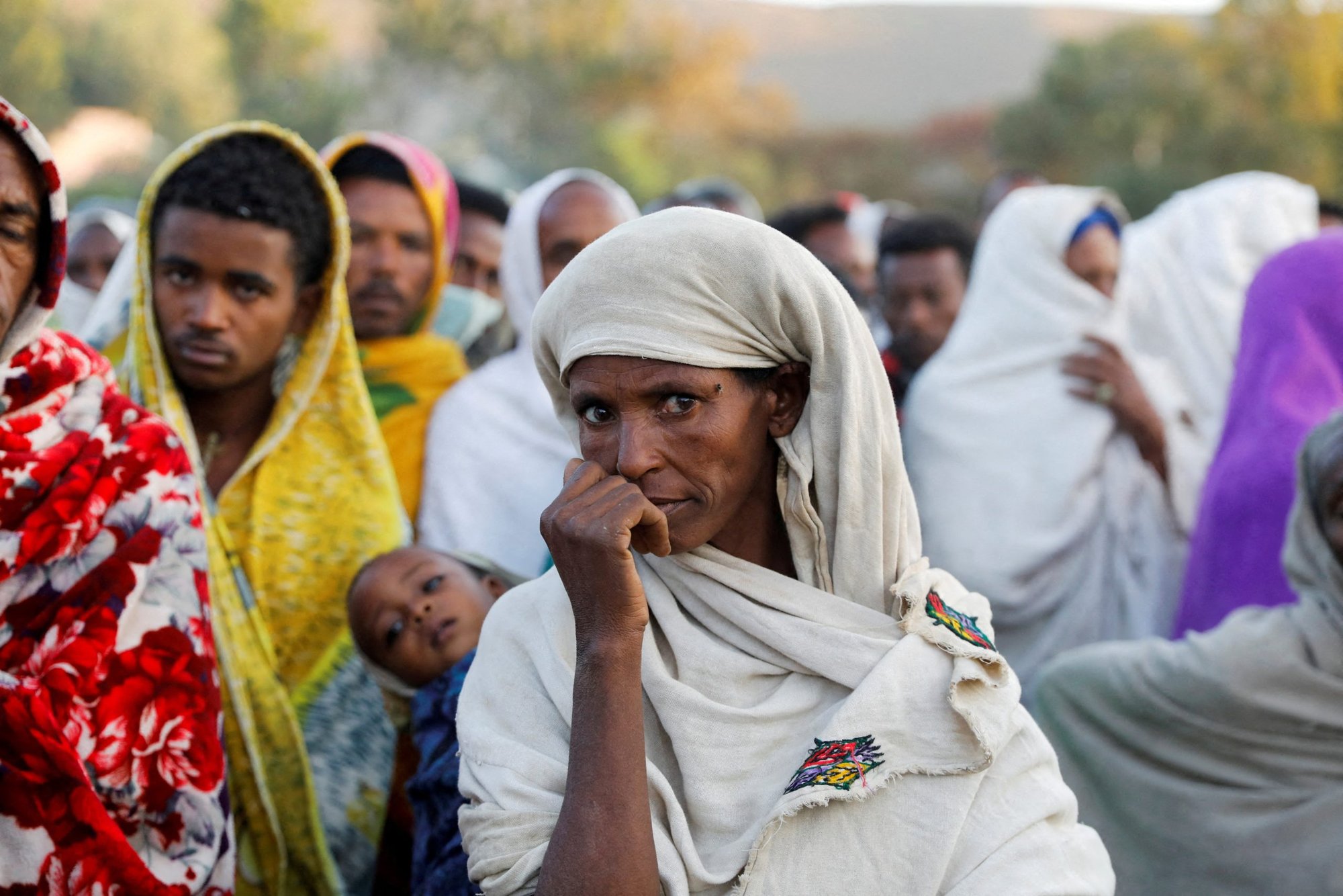 A woman stands in line to receive food donations at the Tsehaye primary school, which was turned into a temporary shelter for people displaced by conflict, in Shire, in Ethiopia's Tigray region, in this March 15, 2021, file photo. During his Oct. 23, 2022, Angelus at the Vatican, Pope Francis appealed to leaders in Ethiopia and its Tigray region to "end the suffering" of the people by negotiating a peace deal; the next day leaders said they are returning to peace talks. (CNS photo/Baz Ratner, Reuters)