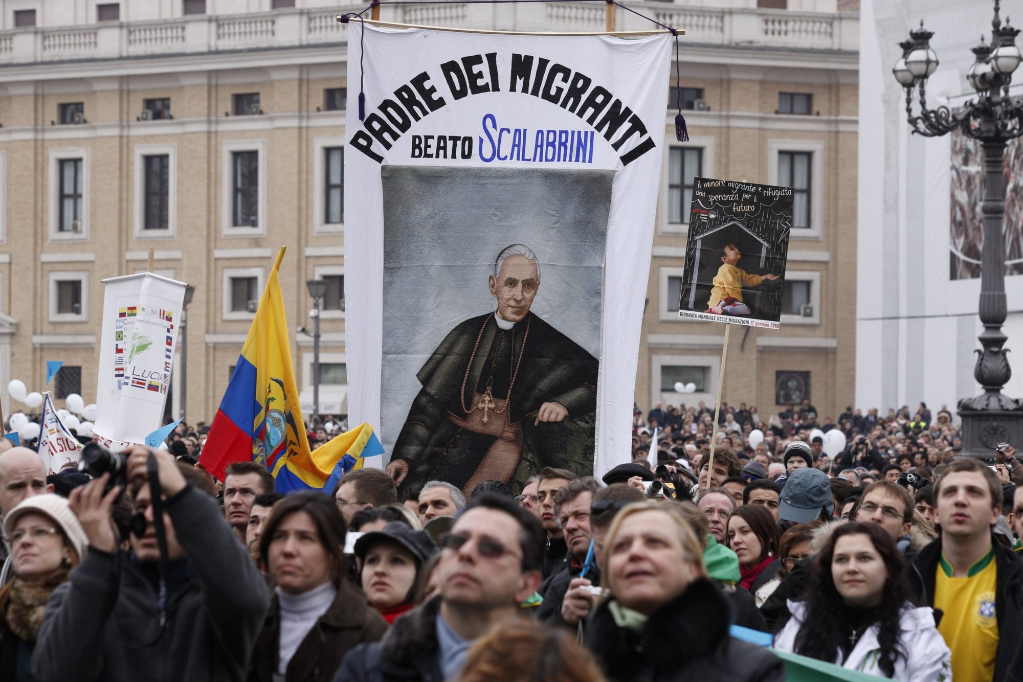 A banner honoring Blessed Giovanni Battista Scalabrini is seen as Pope Benedict XVI leads the Angelus at the Vatican in this Jan. 17, 2010, file photo. On Oct. 9, 2022, Pope Francis will canonize Bishop Scalabrini, who founded separate missionary orders of men and women in the 1880s to provide for the pastoral needs of large numbers of Italian emigrants. (CNS photo/Paul Haring)