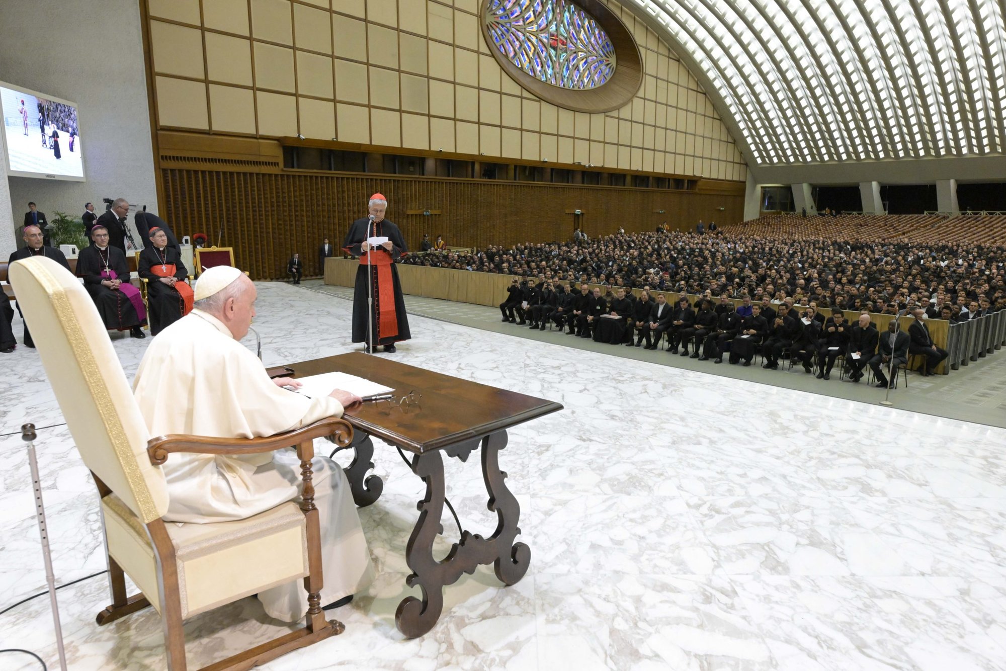 Pope Francis listens to Korean Cardinal Lazarus You Heung-sik, prefect of the Dicastery for Clergy, at the beginning of a meeting with hundreds of seminarians and priests studying in Rome, in the Vatican audience hall, Oct. 24, 2022. (CNS photo/Vatican Media)