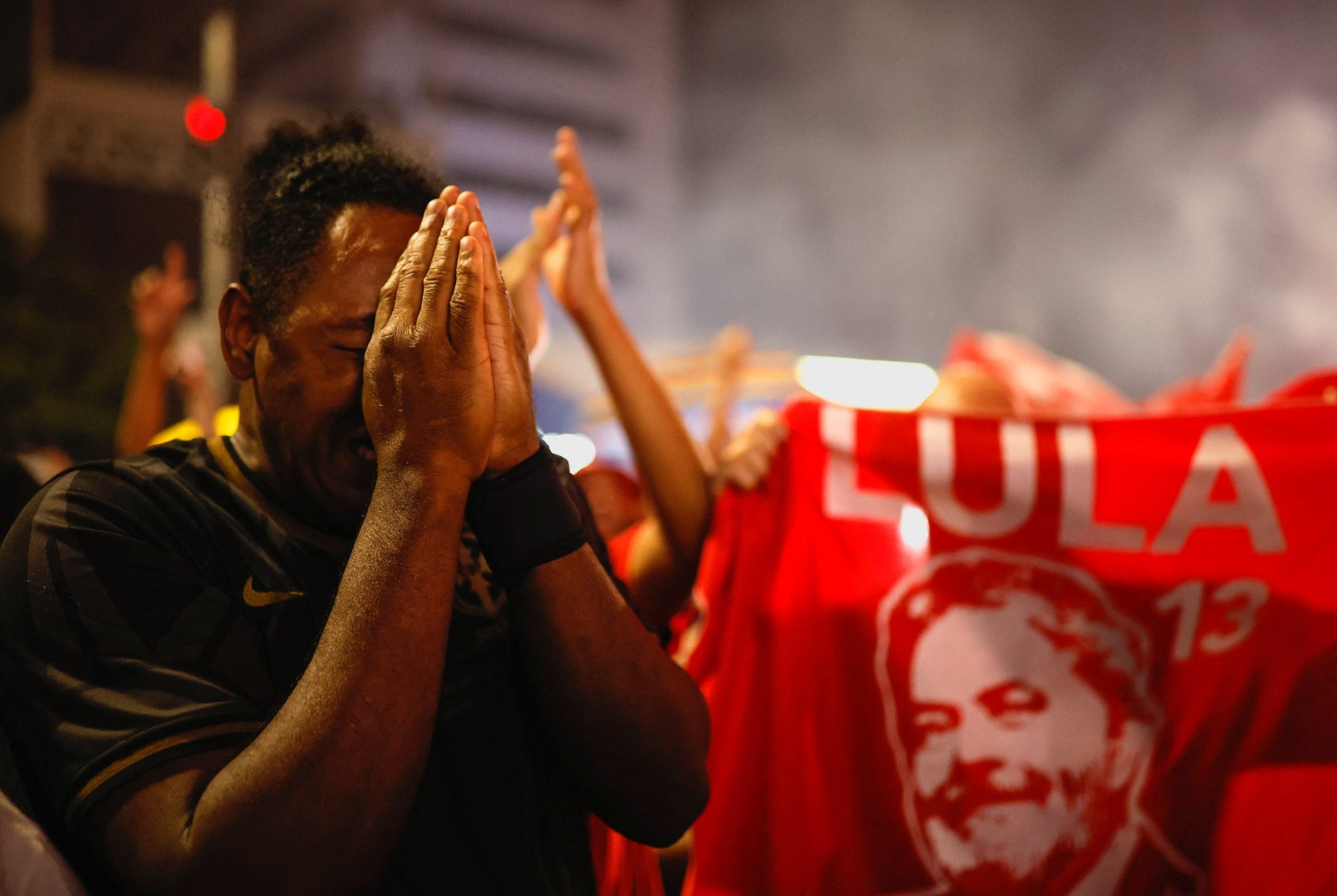 A supporter of Luiz Inacio Lula da Silva reacts as he celebrates election results proclaiming Lula the winner, in São Paulo, Brazil, Oct. 30. (CNS photo/Amanda Perobelli, Reuters)