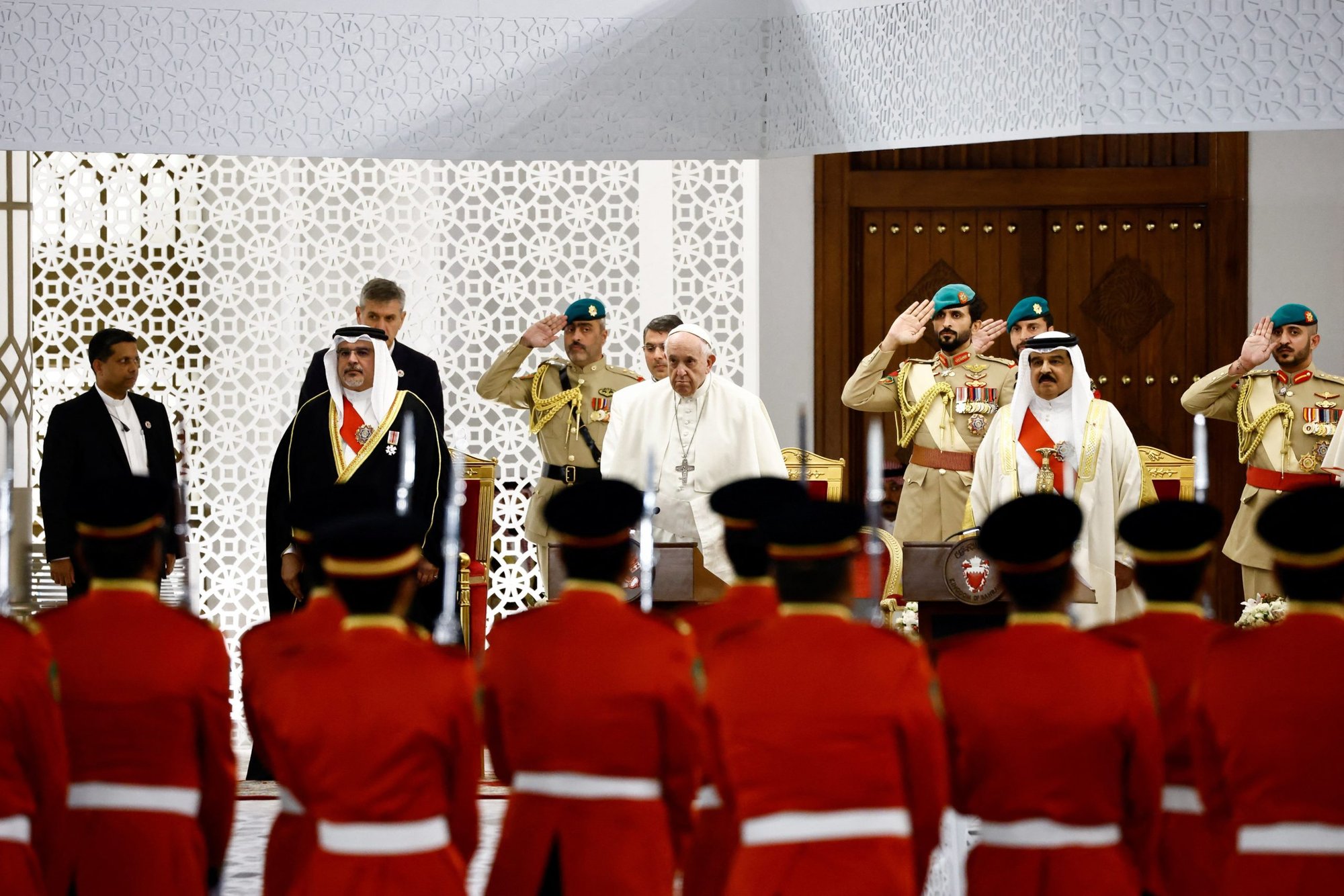 Pope Francis, Bahrain's King Hamad bin Isa Al Khalifa and Crown Prince Salman bin Hammad Al Khalifa attend the welcoming ceremony for the pontiff in the courtyard of Sakhir Palace Nov. 3, 2022. (CNS photo/Yara Nardi, Reuters)