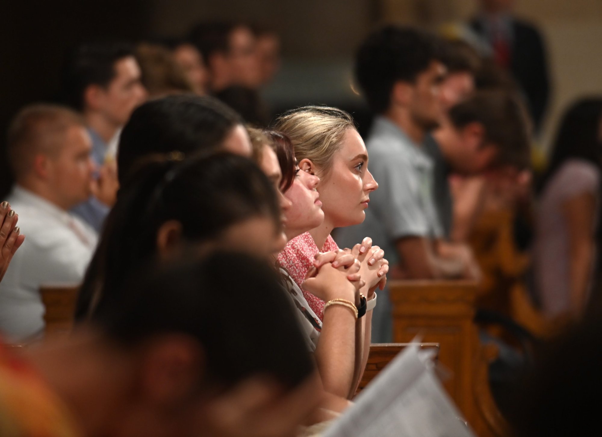 Students at The Catholic University of America pray during the Sept. 1, 2022, Mass of the Holy Spirit at the Basilica of the National Shrine of the Immaculate Conception in Washington, opening the academic year for CUA. (CNS photo/Patrick G. Ryan, courtesy The Catholic University of America)